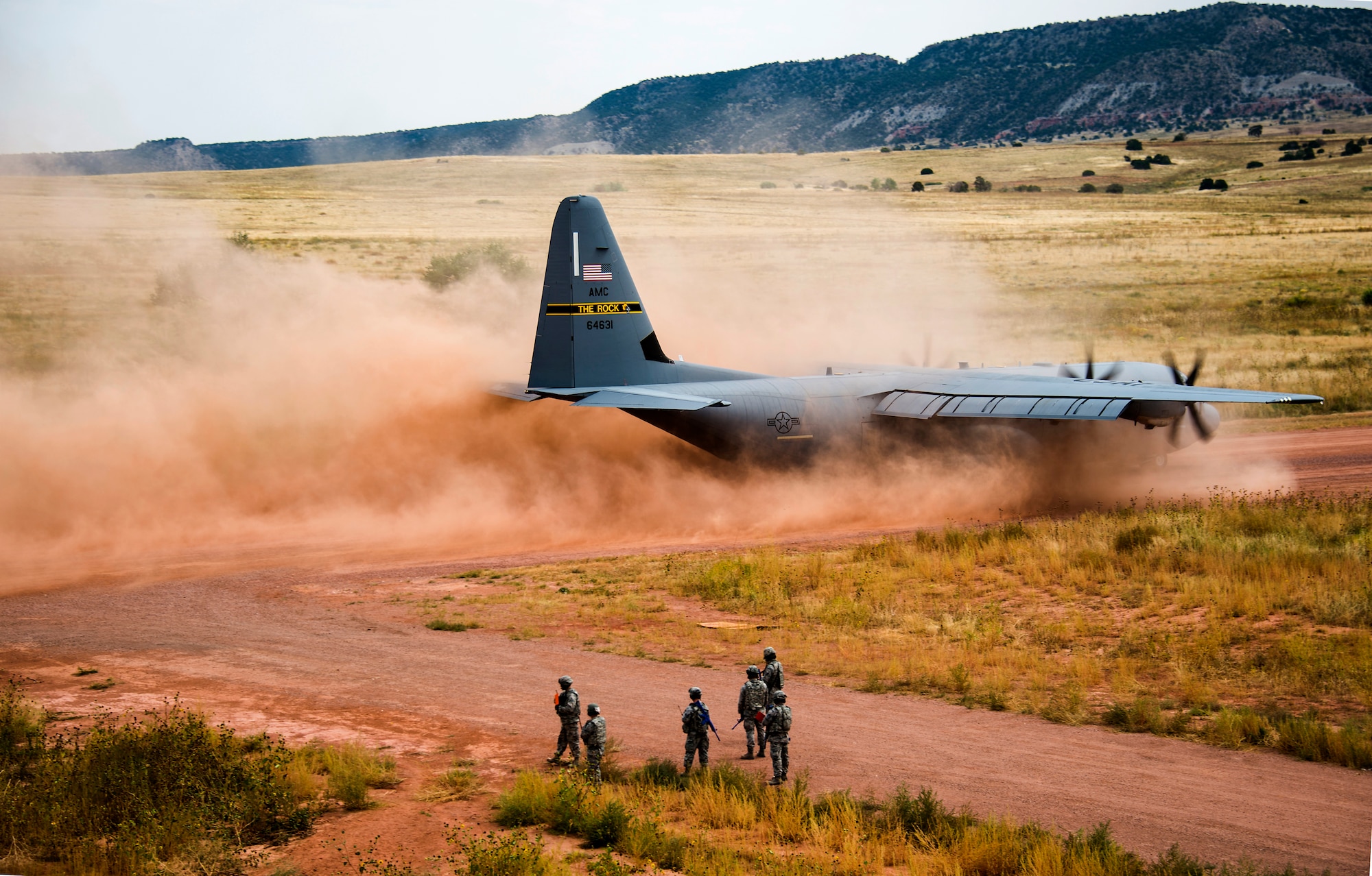 A C-130 Aircraft from the 19th Airlift Wing at Little Rock AFB, AR., lands Red Devil Landing Zone, Colo, during Exercise Cerberus Strike, on September 14, 2015. Over 25 C-130 Aircraft moved passengers and cargo from Peterson, Gunnison, and Red Devil during 12 hour operations. Approximately 150 Airmen from the 821st Contingency Response Group at Travis Air Force Base, Calif., participated in a first-of-its-kind Joint contingency response exercise from Sept. 8-19 at five locations (Southern California Logistics Airfield, Calif., Freedom Landing Zone, Calif., Gunnison Region Airfield, Colo., Red Devil Landing Zone, Colo., Peterson Air Force Base, Colo., and Fort Carson, Colo.). During the training, 821st CRG Airmen supported more than 275 Soldiers from Fort Carson, Colo., during air drop missions, helicopter training, coordinated Apache air support, and personnel and equipment airlift training. The Contingency Response (CR) training was constructed to primarily develop unique CR-oriented training objectives to improve down range effectiveness in preparation for real-world responses. (U.S. Air Force Photos by Tech. Sgt. Matthew Hannen)