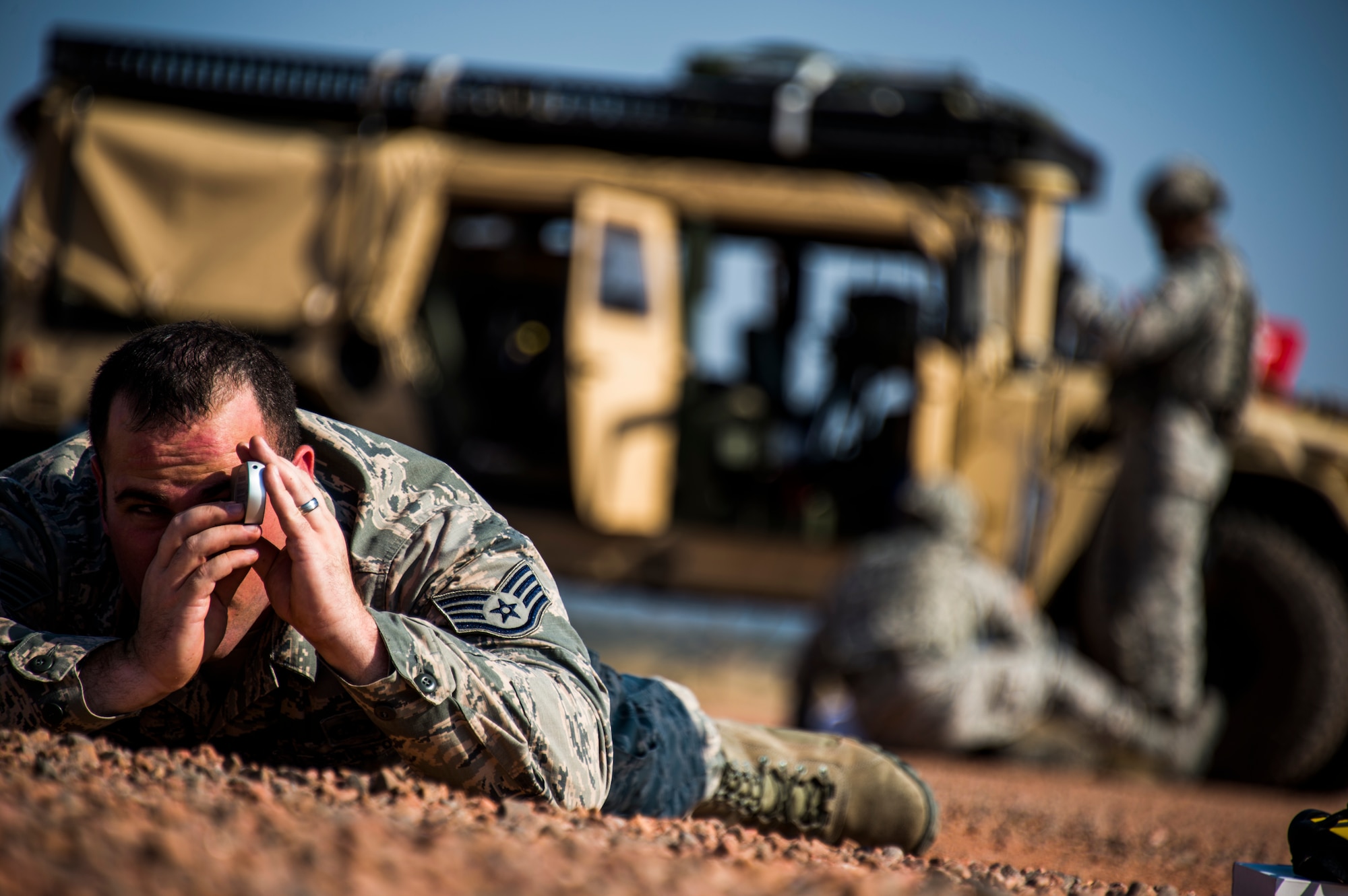 Staff Sgt. William Crew, an air field manager for the 821st Contingency Response Support Squadron from Travis Air Force Base, Calif., conducts an airfield assessment  during Exercise Cerberus Strike, on September 14, 2015. Approximately 150 Airmen from the 821st Contingency Response Group at Travis Air Force Base, Calif., participated in a first-of-its-kind Joint contingency response exercise from Sept. 8-19 at five locations (Southern California Logistics Airfield, Calif., Freedom Landing Zone, Calif., Gunnison Region Airfield, Colo., Red Devil Landing Zone, Colo., Peterson Air Force Base, Colo., and Fort Carson, Colo.). During the training, 821st CRG Airmen supported more than 275 Soldiers from Fort Carson, Colo., during air drop missions, helicopter training, coordinated Apache air support, and personnel and equipment airlift training. The Contingency Response (CR) training was constructed to primarily develop unique CR-oriented training objectives to improve down range effectiveness in preparation for real-world responses. (U.S. Air Force Photos by Tech. Sgt. Matthew Hannen)