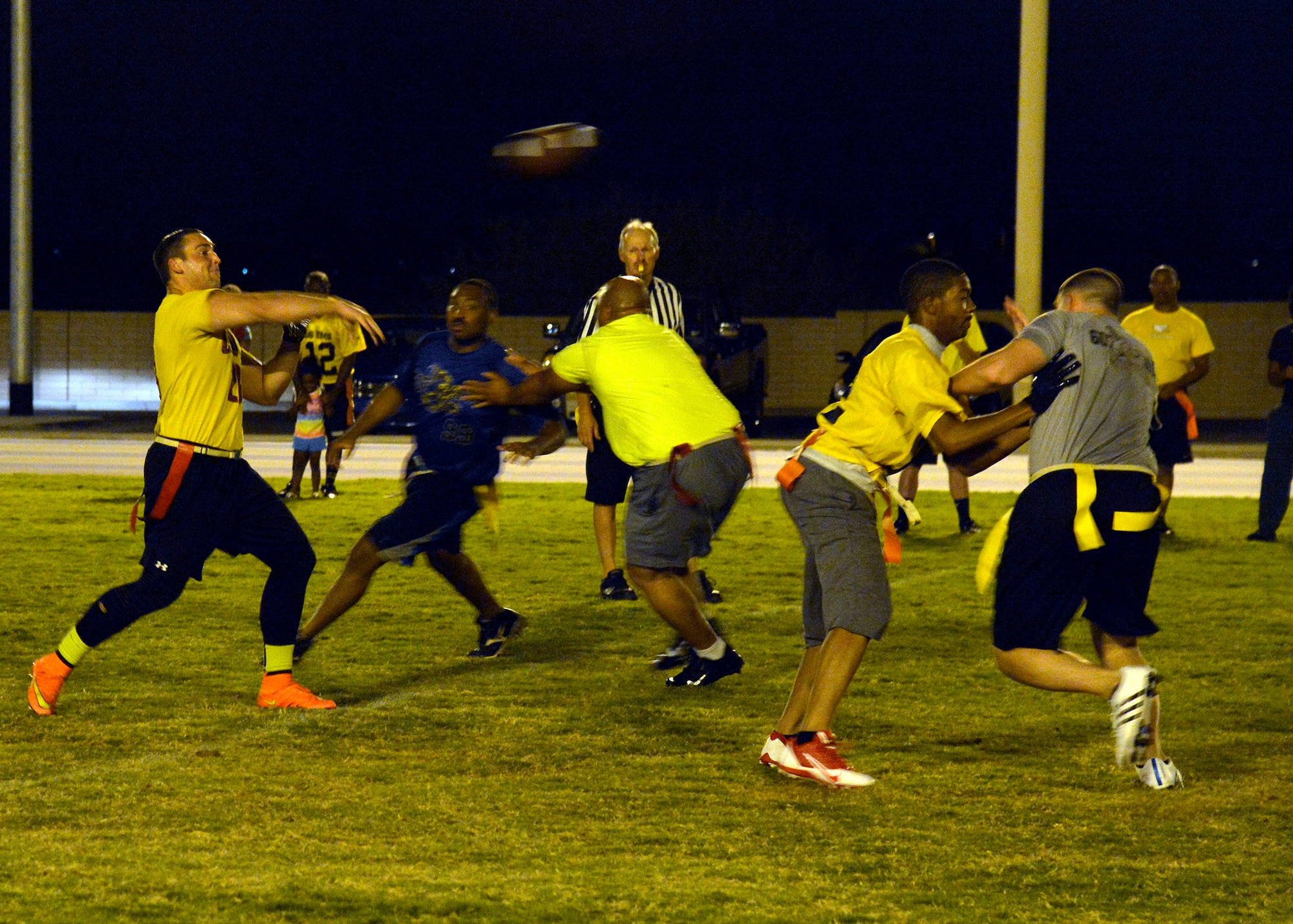 Benjamin Bright, 56th Dental Squadron, throws the football during an intramural flag football game against the 607th Aircraft Maintenance Squadron at Luke Air Force Base, Ariz., Sept. 24, 2015. 56th EMS/AGE defeats 607th ACS 21-14.  (U.S. Air Force photo by Senior Airman Devante Williams)