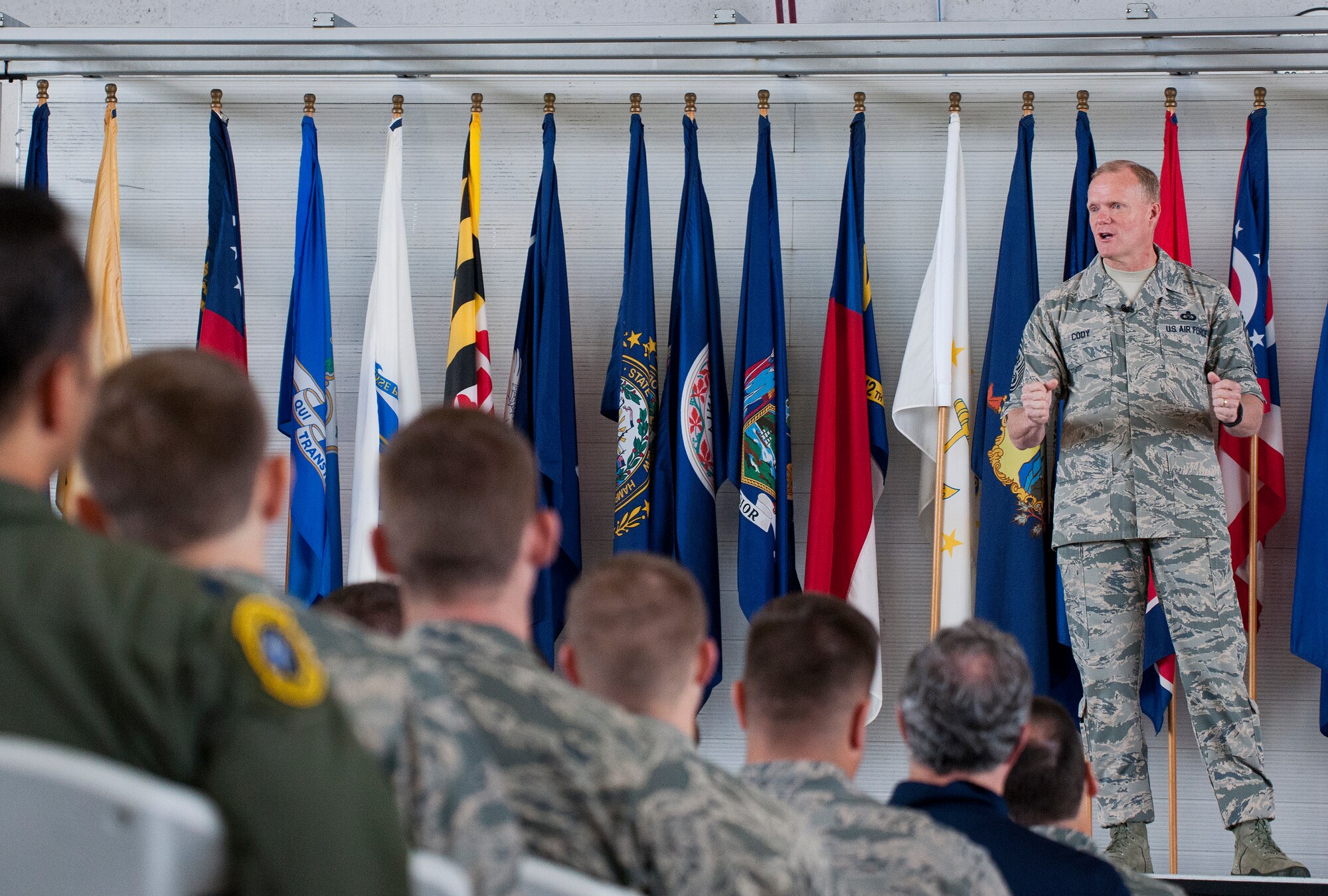 Chief Master Sgt. of the Air Force James Cody speaks to an audience of Airmen at an “All Call” Oct. 2 at Eglin Air Force Base, Fla.  Cody and Air Force Chief of Staff Mark A. Welsh III spent visited Eglin and Hurlburt Field to engage with Airmen.  (U.S. Air Force photo/Samuel King Jr.)