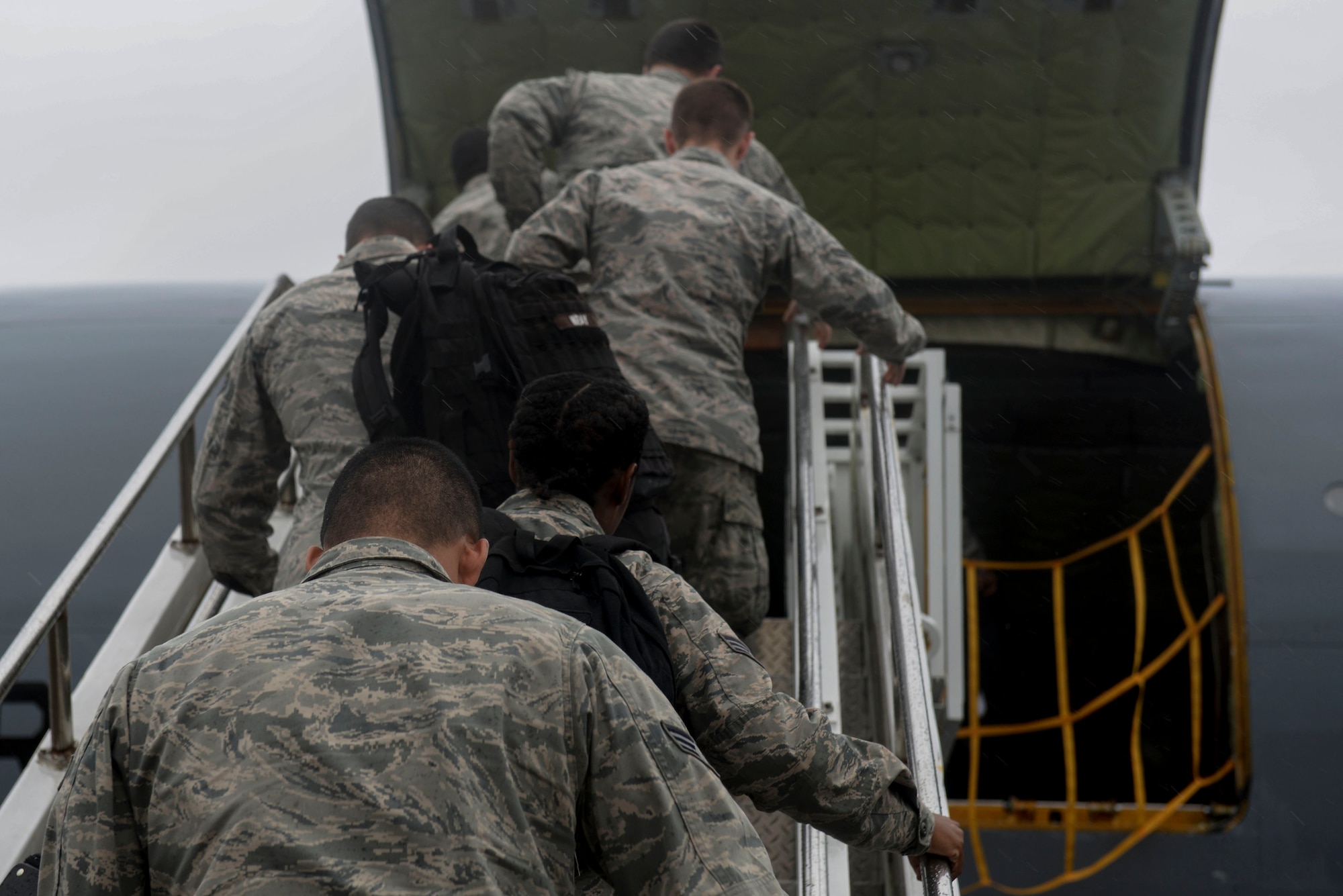 Aircrew boards a KC-135R Stratotanker, Oct. 2, 2015, at Seymour Johnson AFB, North Carolina. To avoid oncoming Hurricane Joaquin, aircrafts at Seymour Johnson AFB were repositioned to Barksdale AFB, Louisiana. (U.S. photo/Airman 1st Class Ashley Williamson)