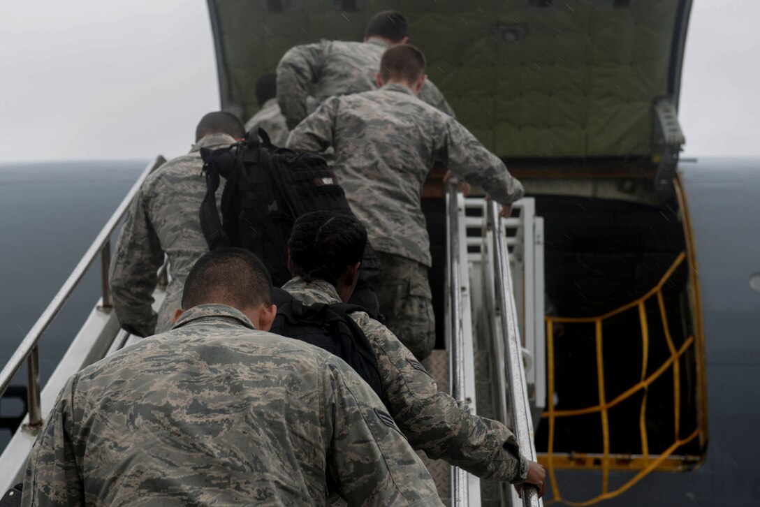 Aircrew boards a KC-135R Stratotanker, Oct. 2, 2015, at Seymour Johnson AFB, North Carolina. To avoid oncoming Hurricane Joaquin, aircrafts at Seymour Johnson AFB were repositioned to Barksdale AFB, Louisiana. (U.S. photo/Airman 1st Class Ashley Williamson)