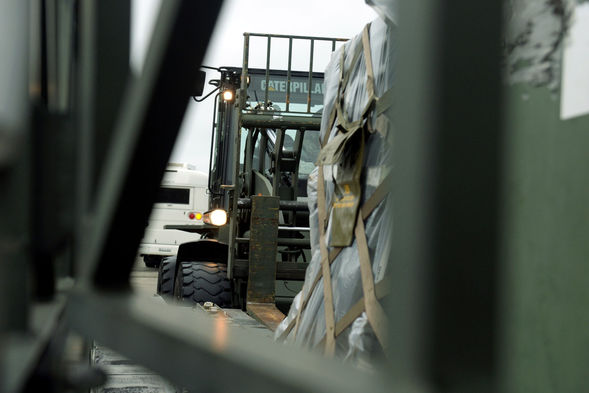 A member assigned to the 4th Logistics Readiness Squadron, uses a forklift to load a pallet of supplies onto a truck, Oct. 1, 2015, at Seymour Johnson Air Force Base, North Carolina. Two KC-135R Stratotankers assigned to the 916th Air Refueling Wing, approximately 60 F-15E Strike Eagles, and more than 190 Airmen were repositioned to Barksdale AFB, Louisiana in response to Hurricane Joaquin. (U.S. photo/Airman 1st Class Ashley Williamson)