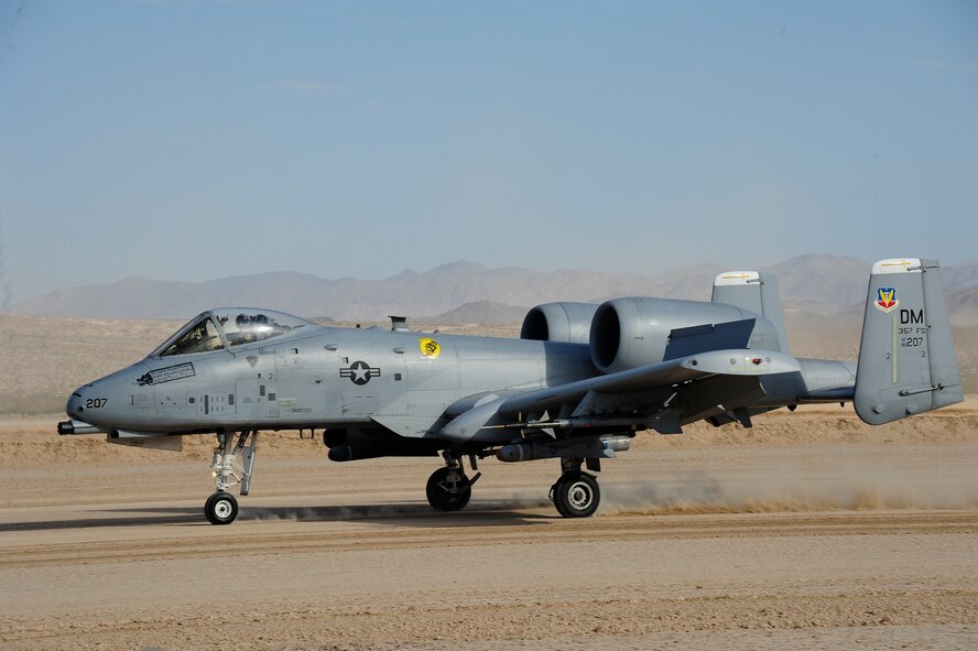 U.S. Air Force Maj. Paul Doran, 357th Fighter squadron pilot, lands an A-10C Thunderbolt II during austere landing training on Bicycle Lake Army Airfield at the National Training Center range, Fort Irwin, Calif., Sept. 22, 2015. The A-10 is the only fighter-type aircraft with the capability to land on unimproved surfaces. (U.S. Air Force photo by Senior Airman Betty R. Chevalier/Released)