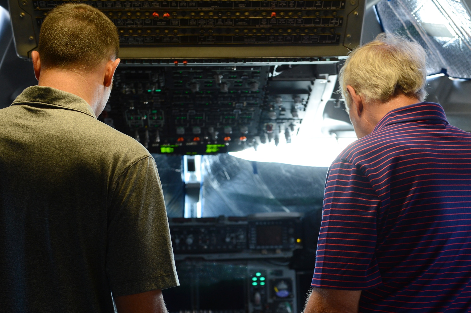 Members of the Vancouver Executive Association tours the cockpit of a C-17 Globemaster III on the McChord Field flight line, Sept. 30, 2015, at Joint Base Lewis-McChord, Wash. The tour provided a means to highlight Team McChord’s capabilities and the professionalism of its service members. (U.S. Air Force photo/Senior Airman Divine Cox)  