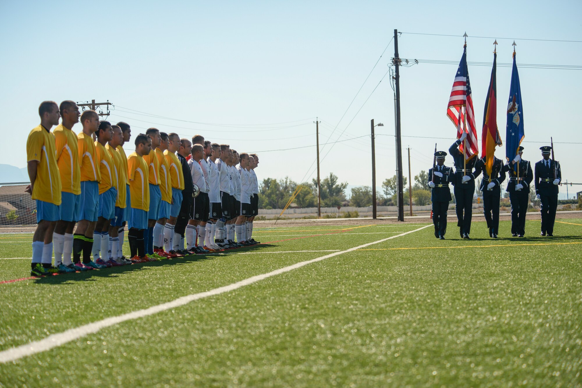 Holloman Air Force Base’s honor guard presents the colors before the annual soccer match between the German Air Force and the U.S. Air Force at Holloman AFB, N.M. on September 26. Every year before Oktoberfest, the German Air Force and Holloman Airmen compete for bragging rights on the soccer field. (U.S. Air Force photo by Airman 1st Class Randahl J. Jenson) 