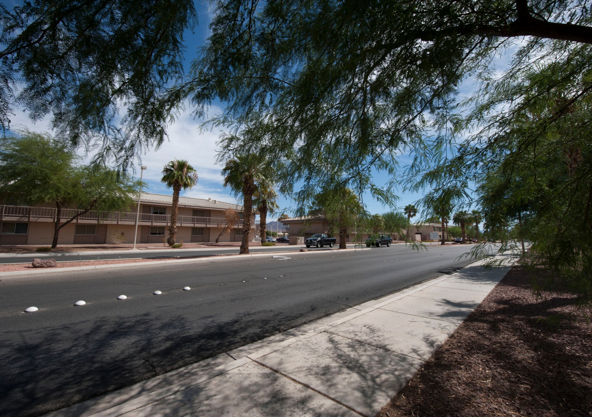 Cars drive down Washington Boulevard on Nellis Air Force Base, Nev., Sept. 30, 2015. Construction on Washington Boulevard began March 16 and was officially completed Sept. 11, 2015. The construction was finished approximately 30 days early. (U.S. Air Force photo by Airman 1st Class Mikaley Kline)