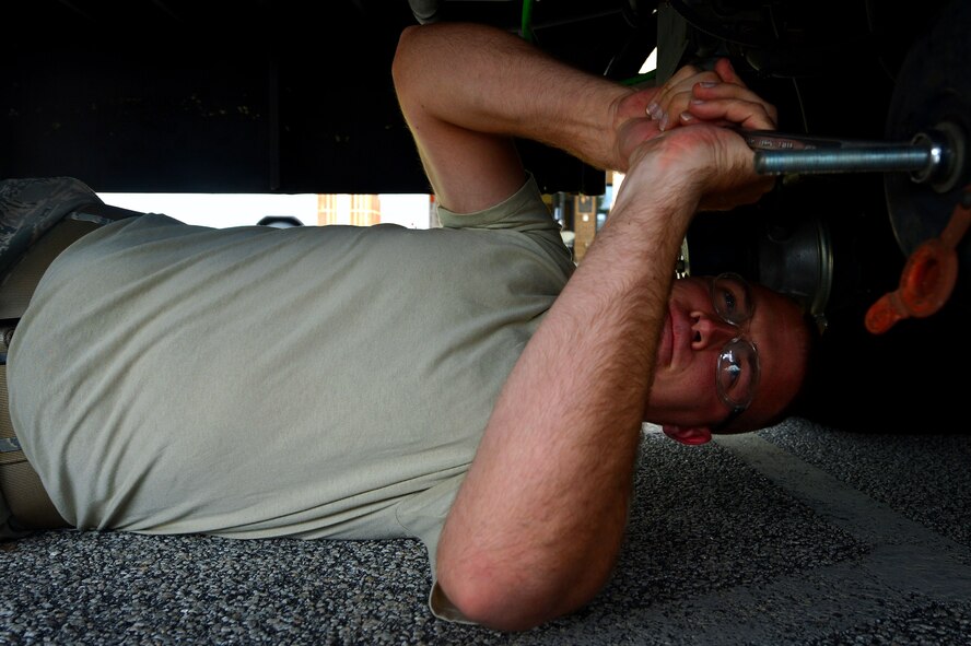 U.S. Air Force Senior Airman David Lee, 20th Logistics Readiness Squadron vehicle maintainer, releases the breaks on a bus at Shaw Air Force Base, S.C., Oct. 2, 2015. The vehicle maintenance shop conducts maintenance on approximately 109 vehicles every month, ensuring all vehicles across the 20th Fighter Wing are operational. (U.S. Air Force photo by Senior Airman Michael Cossaboom/Released)