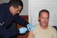 779th Medical Group Immunizations Technician,  Airman 1st Class Jessy Lonzano,  gives 11th Wing Commander, Col. Bradley T. Hoagland, a flu shot vaccination on Oct. 1, 2015. 79th Medical Wing is having a flu vaccination drive on Oct. 20-21 at the theater on Joint Base Andrews, Md. (Photo by Maj. Derrick Whiteside)

