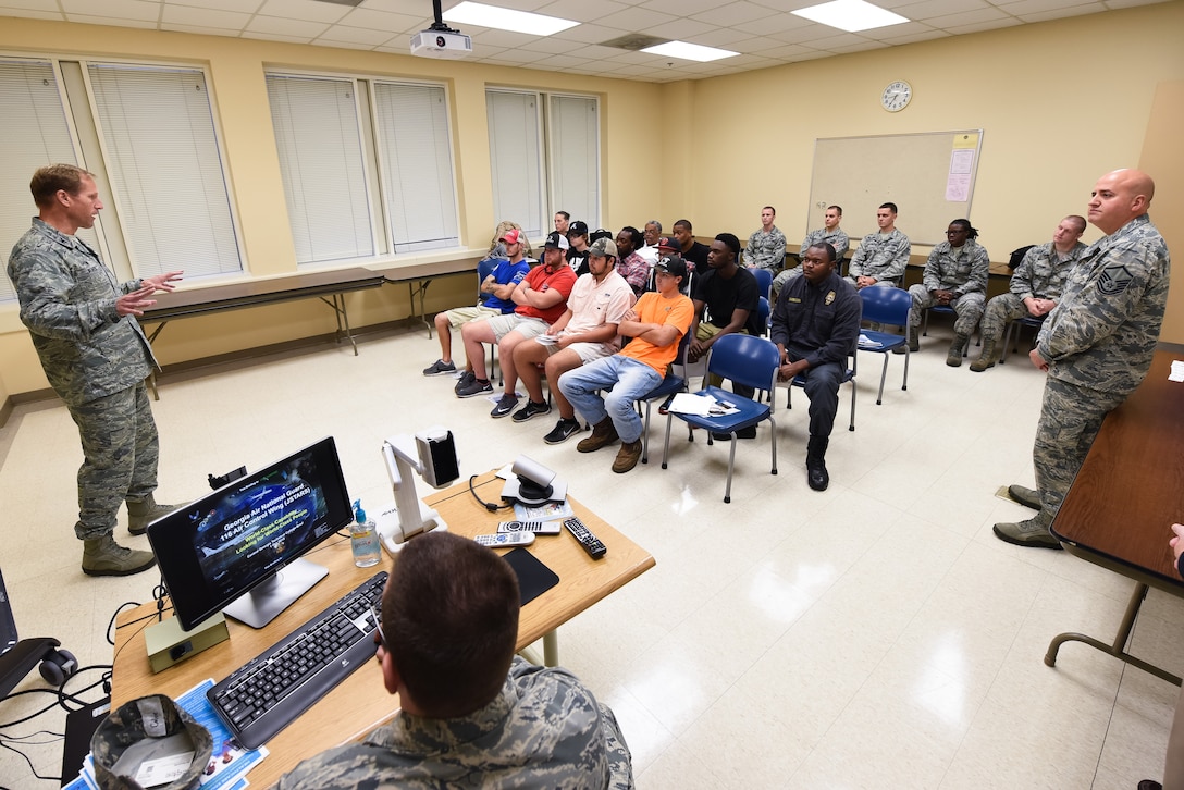 U.S. Air Force Col. Mark Weber, 116th Air Control Wing (ACW) commander, Georgia Air National Guard (ANG), speaks to students at Central Georgia Technical College (CGTC), about the JSTARS mission and aircraft maintenance job opportunities available as Traditional Guardsmen in the 116th ACW at Robins Air Force Base, Warner Robins, Ga., Oct. 1, 2015. Leaders, a group of aircraft maintainers and recruiters from the 116th ACW visited the Warner Robins and Hawkinsville CGTC campuses and conducted simultaneous briefings for the students. Team JSTARS, consisting of the Georgia ANG 116th ACW, Air Force active duty 461st ACW, and ARMY JSTARS, flies the only E-8C Joint Surveillance Target Attack Radar System, or Joint STARS, manned platform providing command and control, intelligence, surveillance, reconnaissance and battle management to combatant commanders across the globe. (U.S. Air National Guard photo by Senior Master Sgt. Roger Parsons/Released)