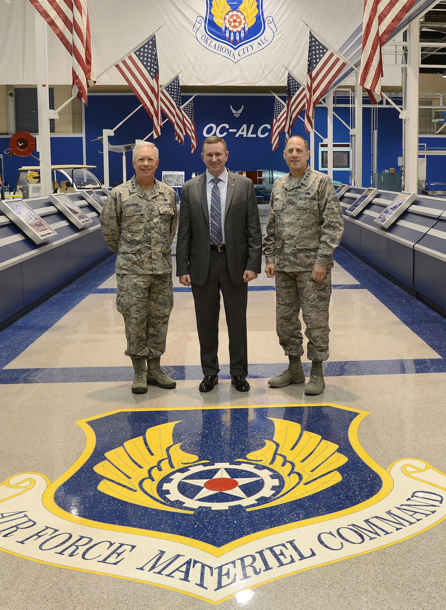 Doug Dynes, national security adviser for Senator Orrin Hatch (R-Utah), center, visited the Air Force Sustainment Center headquarters Tuesday to receive a comprehensive look at the relationship between Air Force Life Cycle Management Center and AFSC as it relates to responsibilities for weapons systems, from acquisition to sustainment to retirement. AFLCMC Commander Lt. Gen. John Thompson, left, and AFSC Commander Lt. Gen. Lee Levy II accompanied Mr. Dynes. The Oklahoma City Air Logistics Complex, one of three AFSC complexes, and AFLCMC program offices highlighted the partnership with a tour of various aircraft production, depot maintenance lines and software platforms. AFSC and AFLCMC lead engineers, Kevin Stamey and John Hedke, also briefed Mr. Dynes with an update on the Complex of the Future and the relationship between AFSC and AFLCMC engineering to reduce material cost and introduce additive manufacturing into the sustainment process, including manufacturing airworthiness parts. (Air Force photo by Kelly White/Released)