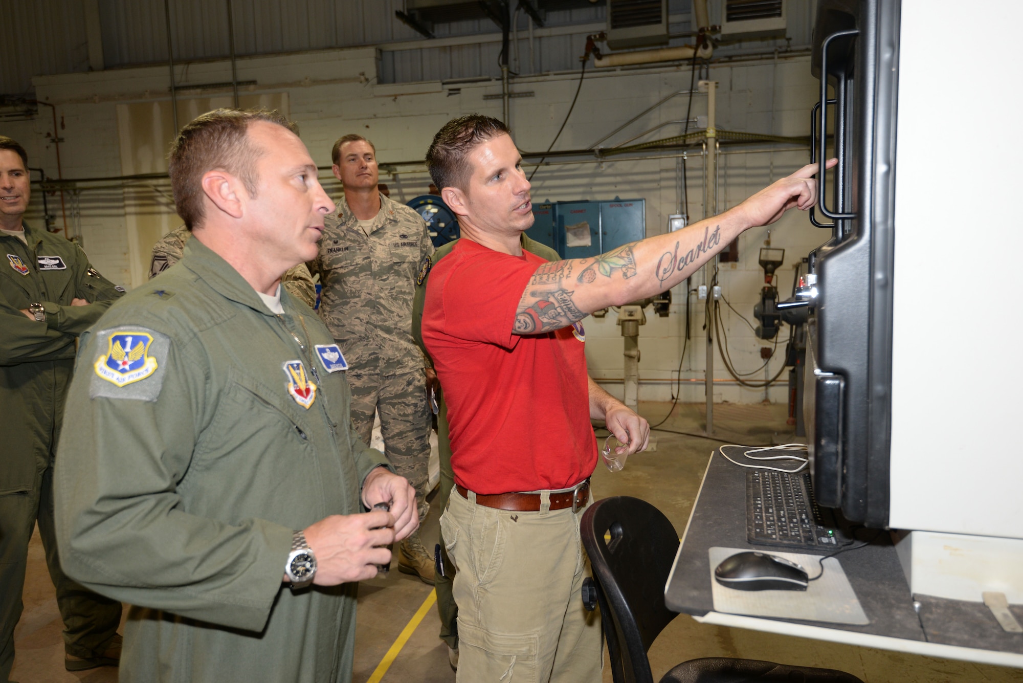 Master Sgt. James Gasaway, an air reserve technician assigned to the 513th Maintenance Squadron, shows off equipment in the fabricator section to Brig. Gen. David Hicks, the vice commander for 1st Air Force, on Sept. 29 during a brief visit to Tinker Air Force Base.  General Hicks toured the 552nd Air Control Wing and 513th Air Control Group to thank Airmen for their efforts in homeland defense and counter-drug operations.   (Air Force photo by Staff Sgt. Caleb Wanzer/Released) 