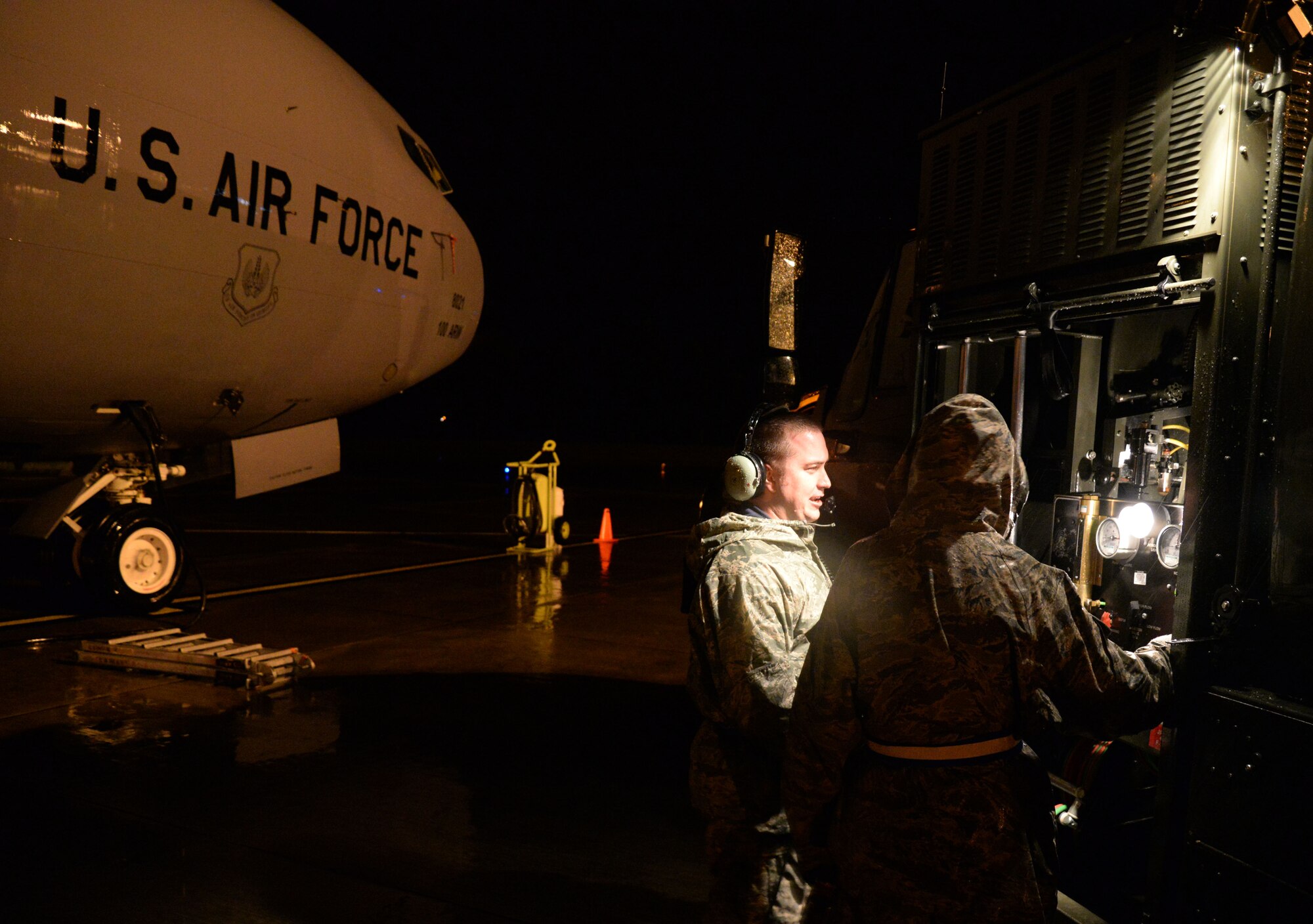 U.S. Air Force Staff Sgt. Phillip Edwards, left, 100th Aircraft Maintenance Squadron crew chief, works with a 100th Logistics Readiness Squadron Fuels distribution operator during pre-flight refueling Sept. 16, 2015, on RAF Mildenhall. The KC-135 Stratotanker has been active for more than 50 years and requires high quality maintenance. Crew chiefs assigned to the 100th AMXS conduct inspections and servicing to ensure the KC-135 accomplishes its primary mission of global reach. (U.S. Air Force photo by Airman 1st Class Justine Rho/released)