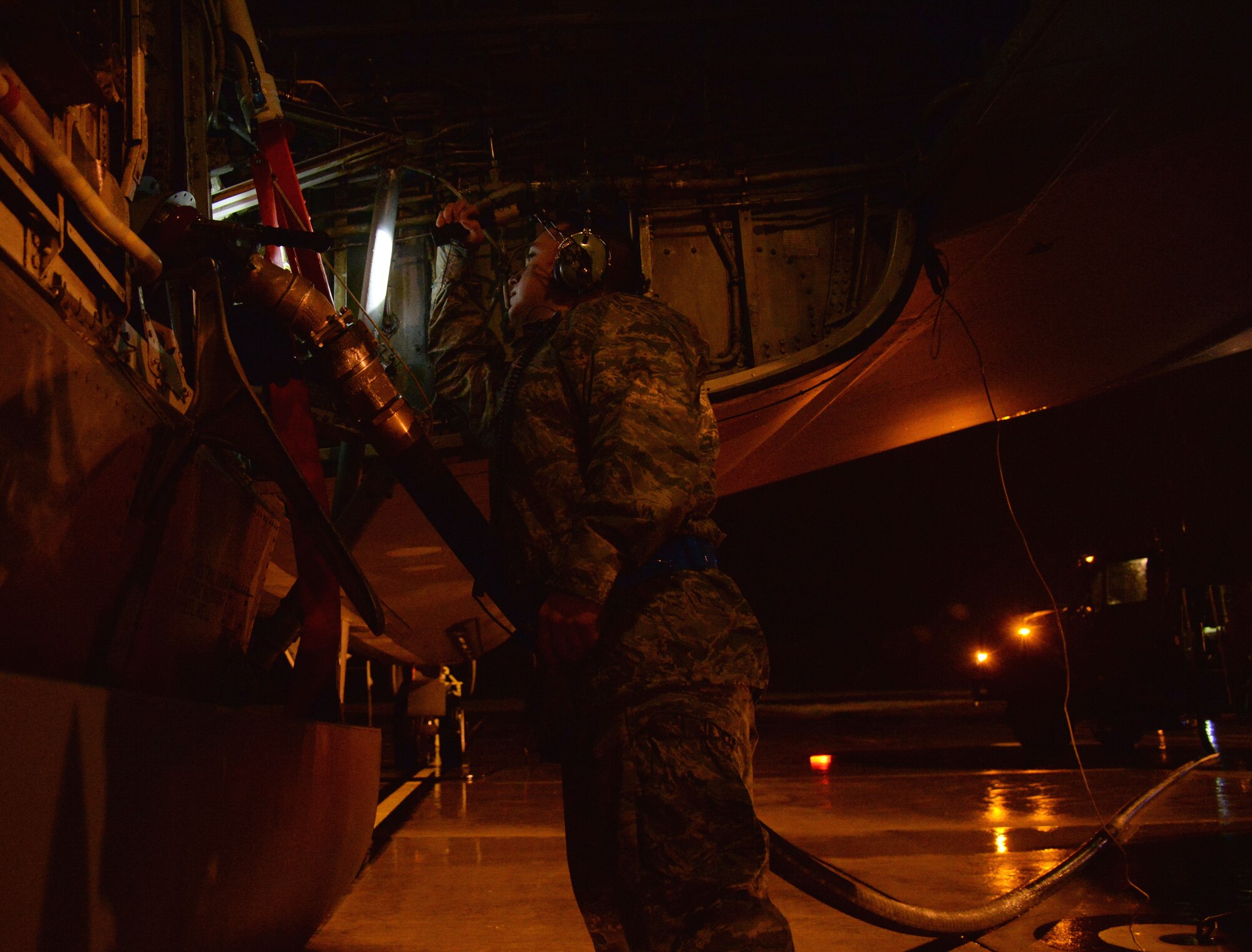 U.S. Air Force Staff Sgt. Phillip Edwards, KC-135 Stratotanker crew chief, checks fuel lines during pre-flight refueling Sept. 16, 2015, on RAF Mildenhall. The KC-135 has been active for more than 50 years and requires high-quality maintenance. Crew chiefs assigned to the 100th Aircraft Maintenance Squadron conduct inspections and servicing to ensure the KC-135 accomplishes its primary mission of global reach. (U.S. Air Force photo by Airman 1st Class Justine Rho/released)
