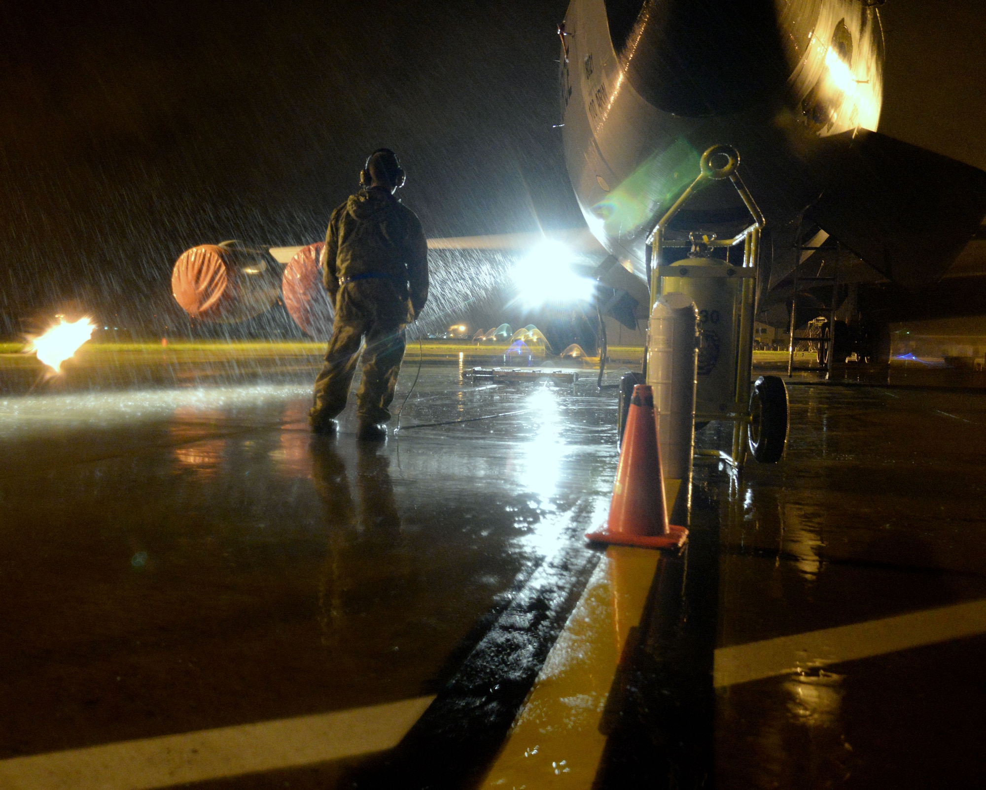 A U.S. Air Force KC-135 Stratotanker crew chief performs light inspections during pre-flight inspection Sept. 16, 2015, on RAF Mildenhall, England. The 100th Aircraft Maintenance Squadron crew chiefs perform aircraft inspections to ensure all aircraft components are in working order. (U.S. Air Force photo by Airman 1st Class Justine Rho/released)   