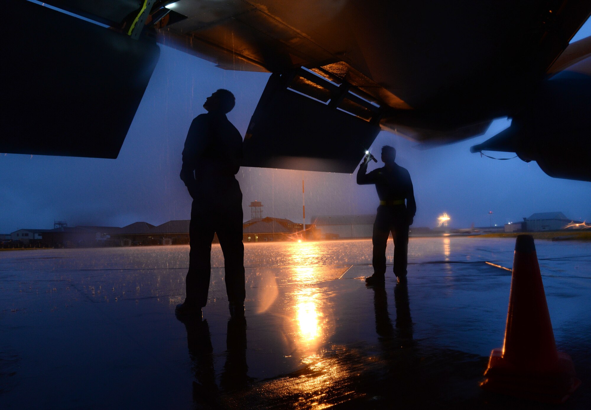 U.S. Air Force KC-135 Stratotanker crew chiefs perform pre-flight checks Sept. 16, 2015, on RAF Mildenhall, England. Crew chiefs assigned to the 100th Aircraft Maintenance Squadron perform aircraft maintenance 24/7 and conduct inspections and servicing to ensure the KC-135 accomplishes its primary mission of global reach. (U.S. Air Force photo by Airman 1st Class Justine Rho/released) 