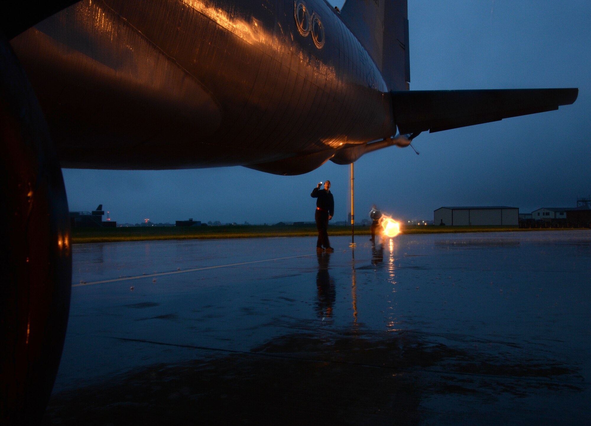 U.S. Air Force Airman 1st Class Ethan Jones, 100th Aircraft Maintenance Squadron crew chief, checks the boom during pre-flight inspection Sept. 16, 2015, on RAF Mildenhall. The KC-135 Stratotanker has been active for more than 50 years and requires high-quality maintenance. Crew chiefs assigned to the 100th AMXS conduct inspections and servicing to ensure the KC-135 accomplishes its primary mission of global reach. (U.S. Air Force photo by Airman 1st Class Justine Rho/released)