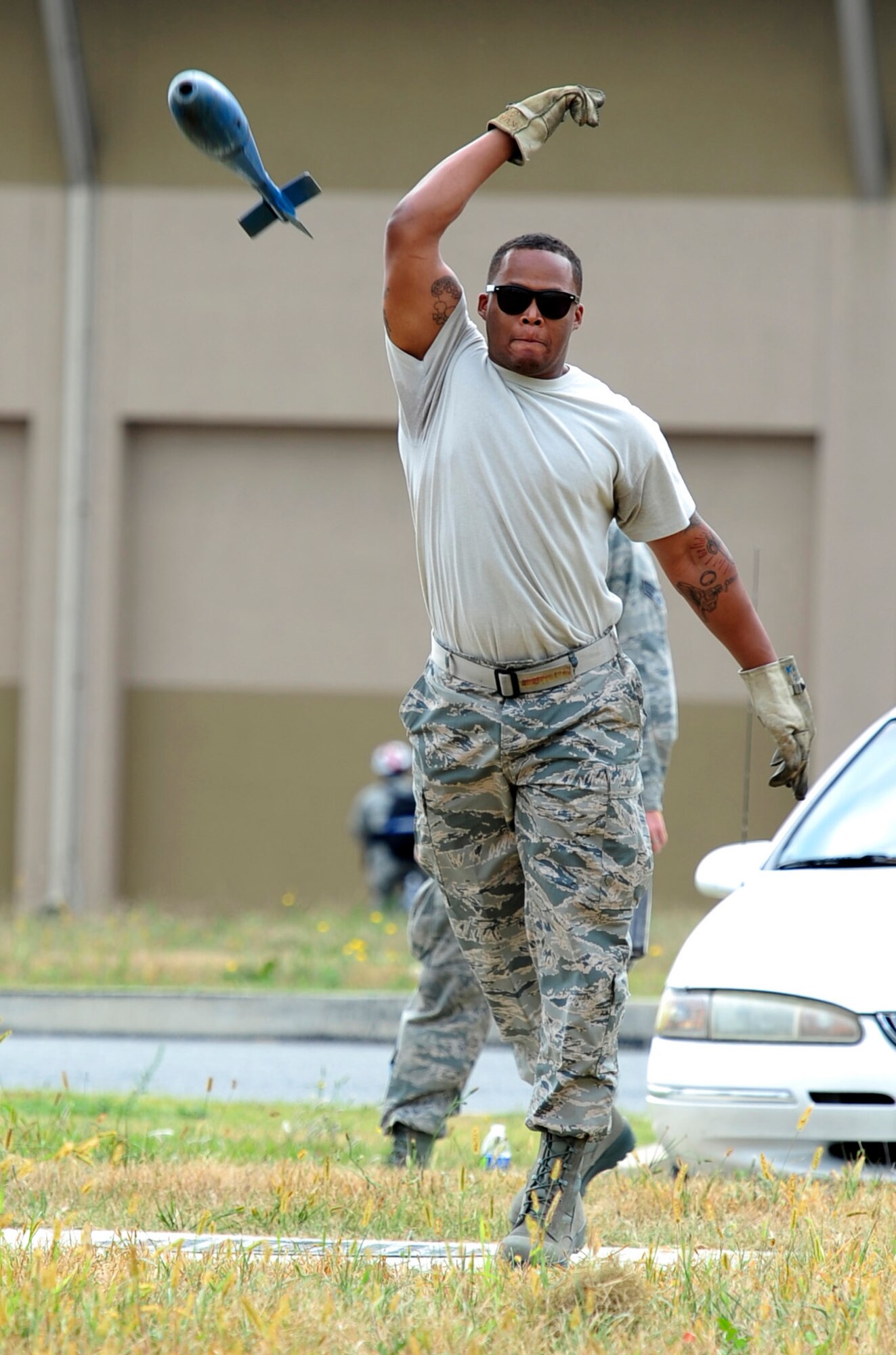 Staff Sgt. Del Rico Harris, 80th Aircraft Maintenance Unit weapons load crew chief, participates in a munition toss contest during an 8th Maintenance Group Safety Olympics event at Kunsan Air Base, Republic of Korea, Sept. 30, 2015. The purpose of the event was to highlight the importance of workplace safety while simultaneously drawing camaraderie among all Airmen in the 8th MXG. (U.S. Air Force photo by Staff Sgt. Nick Wilson/Released)