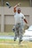 Staff Sgt. Del Rico Harris, 80th Aircraft Maintenance Unit weapons load crew chief, participates in a munition toss contest during an 8th Maintenance Group Safety Olympics event at Kunsan Air Base, Republic of Korea, Sept. 30, 2015. The purpose of the event was to highlight the importance of workplace safety while simultaneously drawing camaraderie among all Airmen in the 8th MXG. (U.S. Air Force photo by Staff Sgt. Nick Wilson/Released)