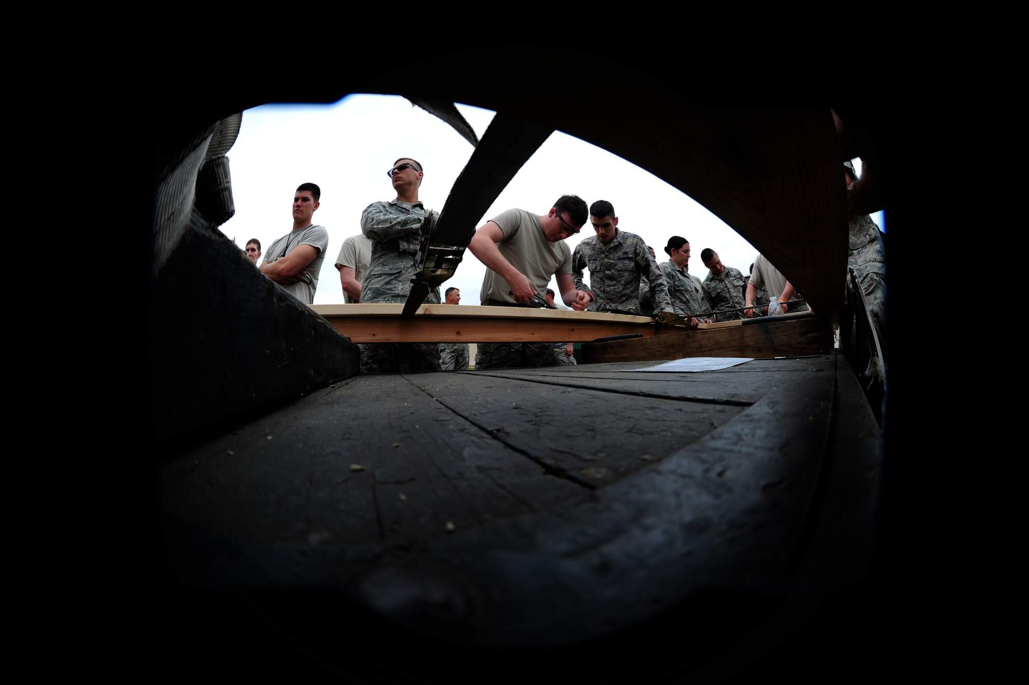 Airmen from the 8th Maintenance Squadron fabrication flight participate in a safety wire challenge during an 8th Maintenance Group Safety Olympics event at Kunsan Air Base, Republic of Korea, Sept. 30, 2015. The purpose of the event was to highlight the importance of workplace safety while simultaneously drawing camaraderie among all Airmen in the 8th MXG. (U.S. Air Force photo by Staff Sgt. Nick Wilson/Released)