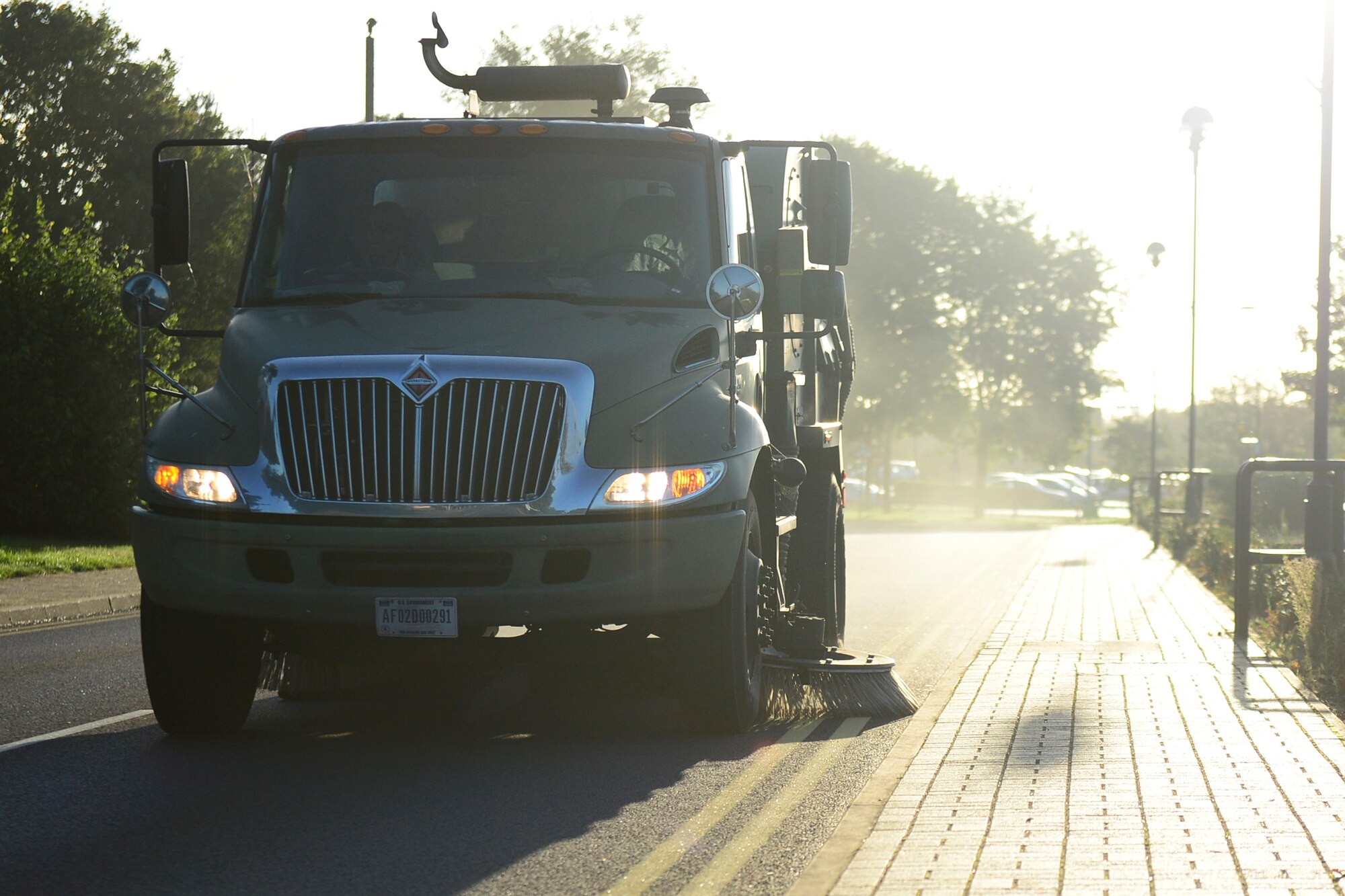 Airmen from the 48th Civil Engineer Squadron operate a street sweeper for a Base Clean-up event at Royal Air Force Lakenheath, England, Sept. 25, 2015. Keeping the base clean also removes debris that could potential result in foreign object damage incidents. (U.S. Air Force photo by Airman 1st Class Erin R. Babis/Released)
