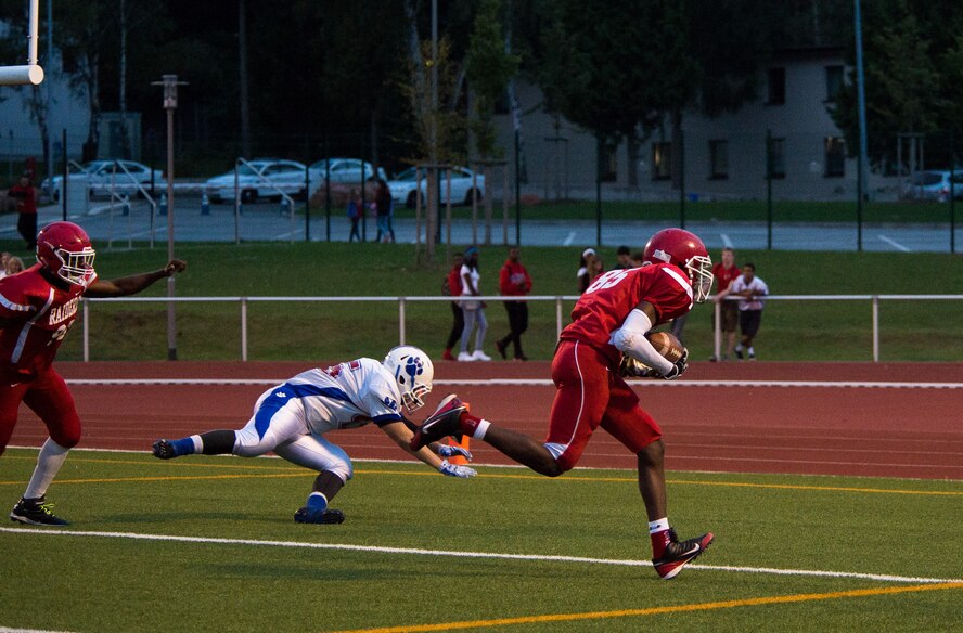 Terrell Robbins, Kaiserslautern Raiders linebacker, runs toward the end zone after recovering a fumble Sept. 25, 2015, at Vogelweh Military Complex, Germany. Robbins scored the first touchdown of the game. (U.S. Air Force photo/Senior Airman Damon Kasberg)