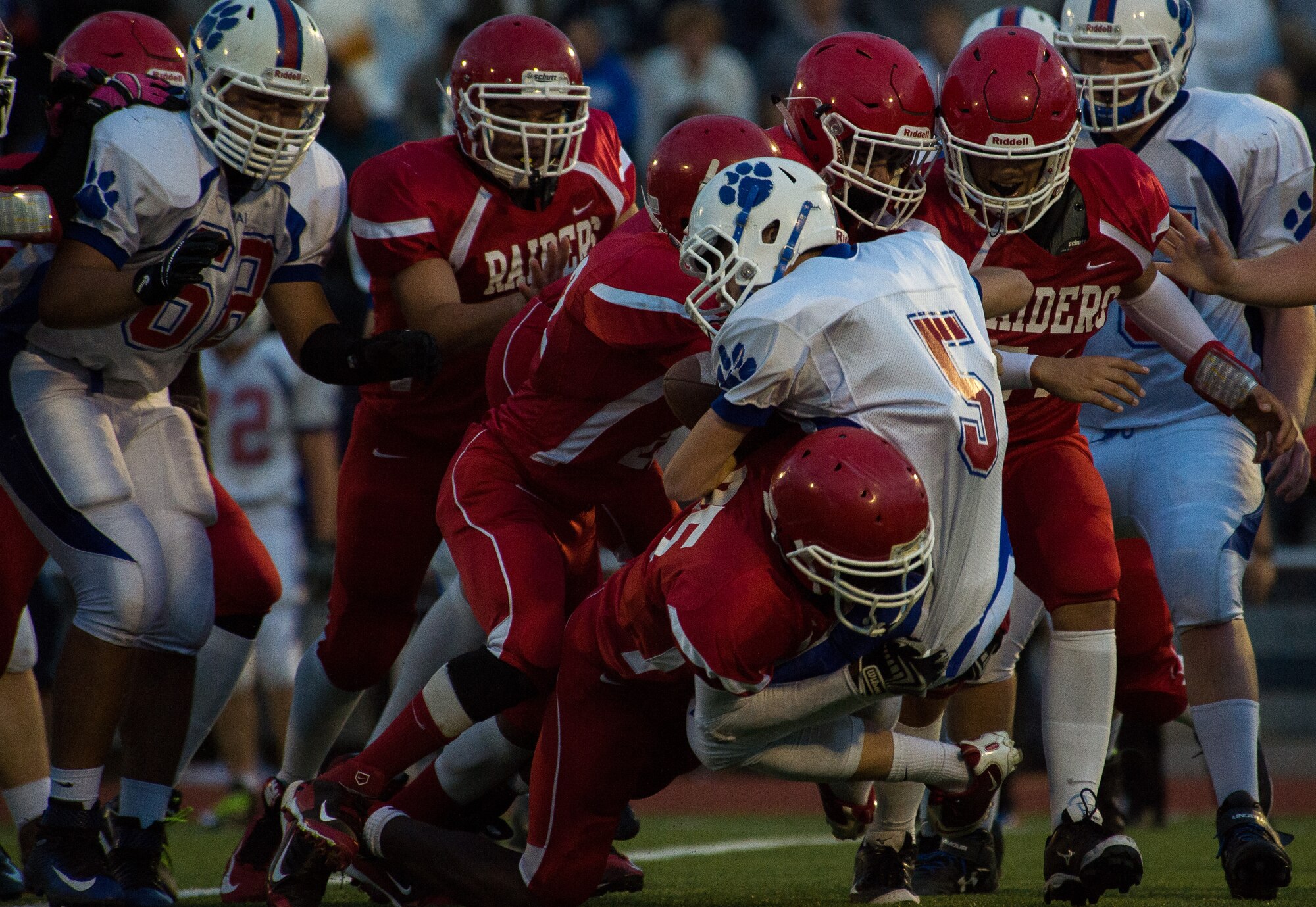 Kaiserslautern Raiders defensive linemen tackle Trevor Miller, Ramstein Royals quarterback, Sept. 25, 2015, at Vogelweh Military Complex, Germany. Even though the Raiders defense forced multiple turnovers, the Royals came out with a 27-14 victory. (U.S. Air Force photo/Senior Airman Damon Kasberg)