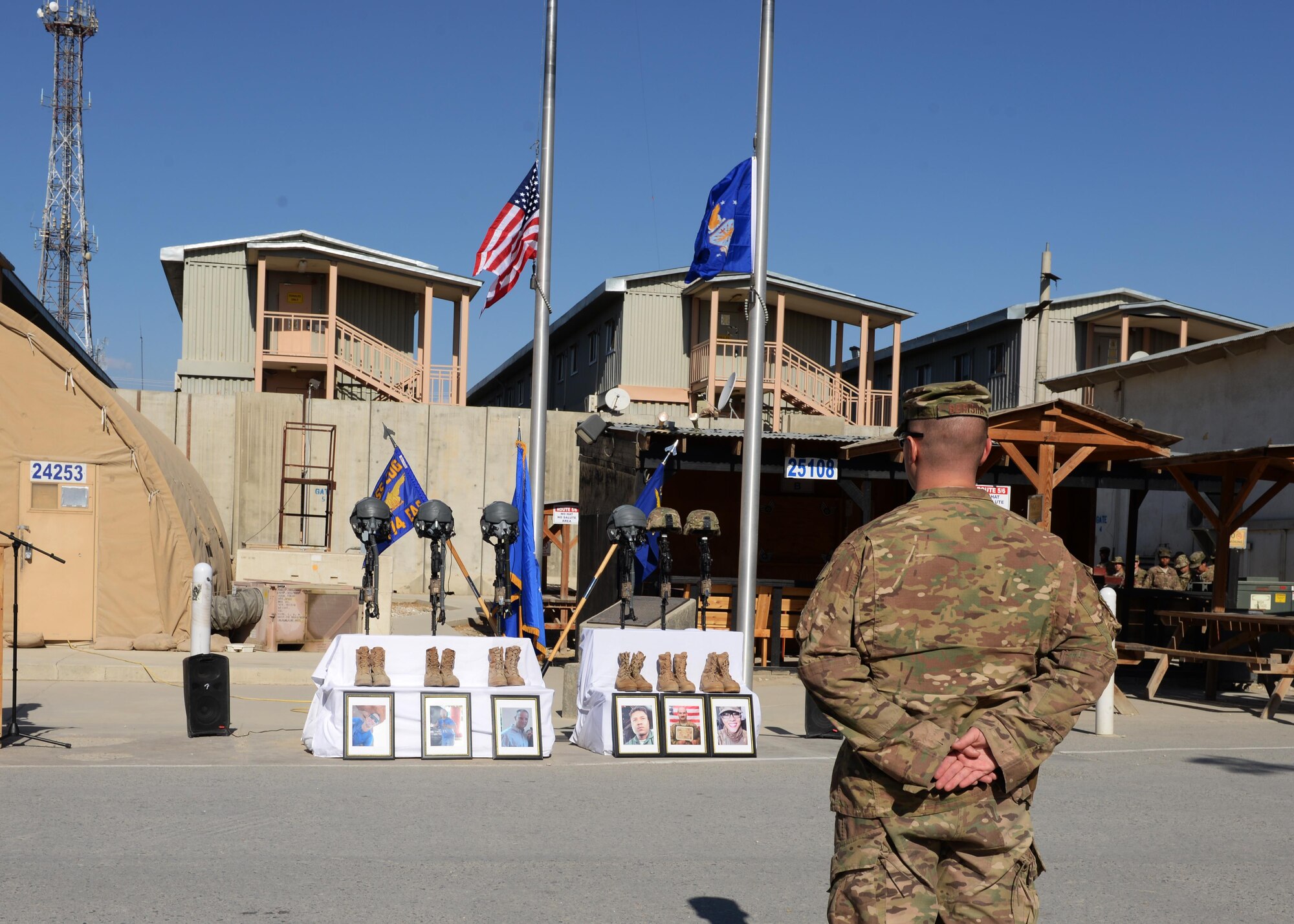 U.S. Air Force Maj. Met Berisha, 455th Expeditionary Security Forces Squadron commander, stands at parade rest during a fallen comrade memorial ceremony held in honor of six Airmen Oct. 3, 2015, at Bagram Airfield, Afghanistan. The six Airmen, four who were pilots and crew members, Capts. Jordan Pierson and Jonathan Golden, Staff Sgt. Ryan Hammond and Senior Airman Quinn Johnson-Harris, and two who were security forces fly away security team members, Airman 1st Class Kcey Ruiz and Senior Airman Nathan Sartain, lost their lives when their C-130J crashed shortly after take-off from Jalalabad Airfield in Afghanistan, Oct. 2, 2015. (U.S. Air Force photo by Senior Airman Cierra Presentado/Released)