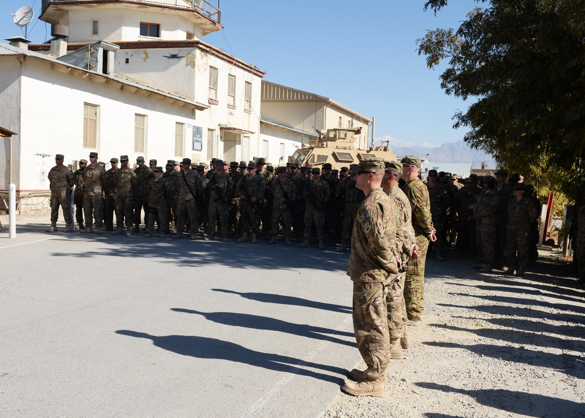Airmen of the 455th Air Expeditionary Wing gather to pay their respect and mourn the loss of six Airmen during a fallen comrade memorial ceremony Oct. 3, 2015, at Bagram Airfield, Afghanistan. The six Airmen, four who were pilots and crew members, Capts. Jordan Pierson and Jonathan Golden, Staff Sgt. Ryan Hammond and Senior Airman Quinn Johnson-Harris, and two who were security forces fly away security team members, Airman 1st Class Kcey Ruiz and Senior Airman Nathan Sartain, lost their lives when their C-130J crashed shortly after take-off from Jalalabad Airfield in Afghanistan, Oct. 2, 2015. (U.S. Air Force photo by Senior Airman Cierra Presentado/Released) 
