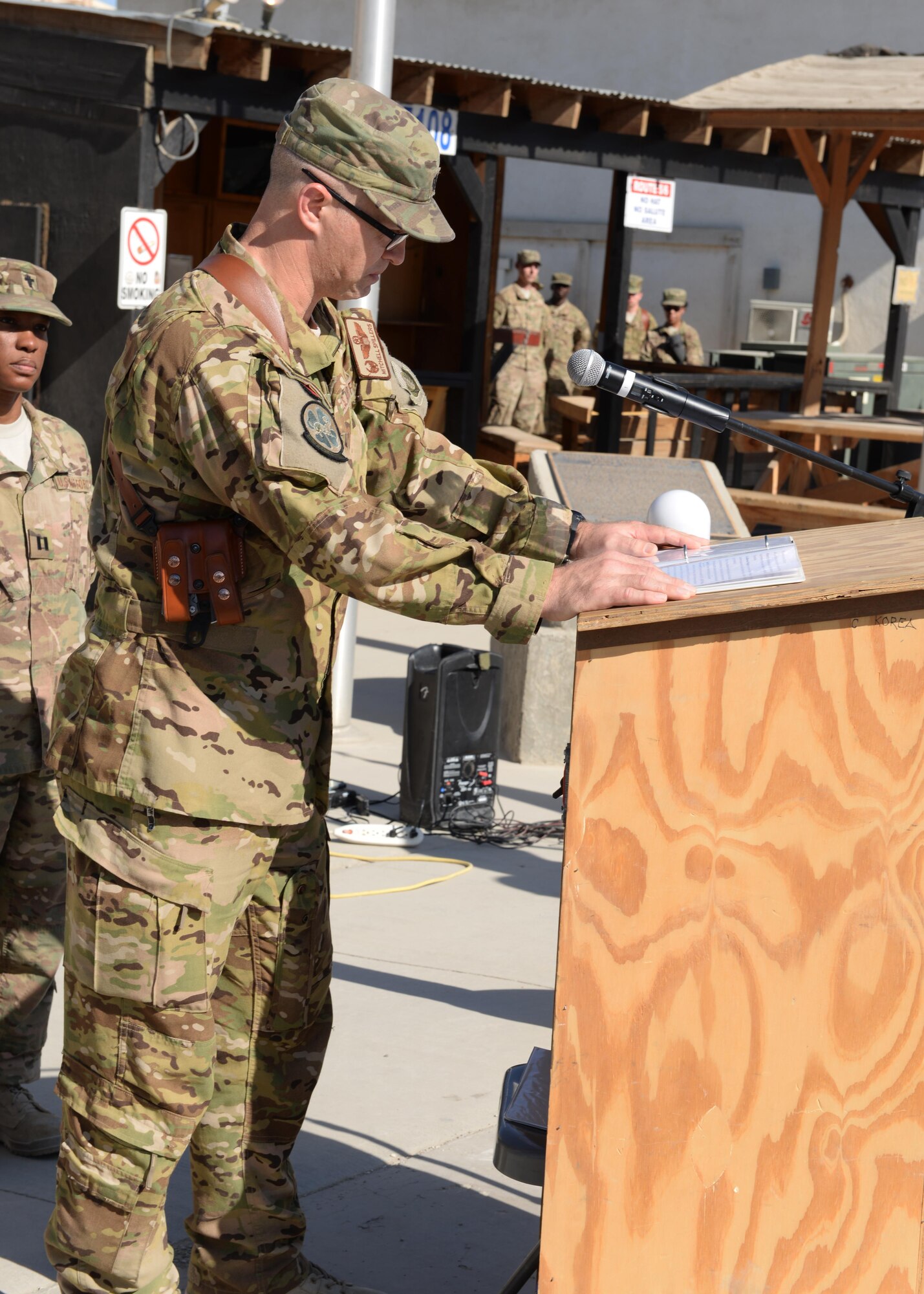 U.S. Air Force Lt. Col. Mitchell Spillers, 774th Expeditionary Airlift Squadron commander, shares his condolences to Airmen of the 455th Air Expeditionary Wing during a fallen comrade memorial ceremony held in honor of six Airmen Oct. 3, 2015, at Bagram Airfield, Afghanistan. The six Airmen, four who were pilots and crew members, Capts. Jordan Pierson and Jonathan Golden, Staff Sgt. Ryan Hammond and Senior Airman Quinn Johnson-Harris, and two who were security forces fly away security team members, Airman 1st Class Kcey Ruiz and Senior Airman Nathan Sartain, lost their lives when their C-130J crashed shortly after take-off from Jalalabad Airfield in Afghanistan, Oct. 2, 2015. (U.S. Air Force photo by Senior Airman Cierra Presentado/Released)