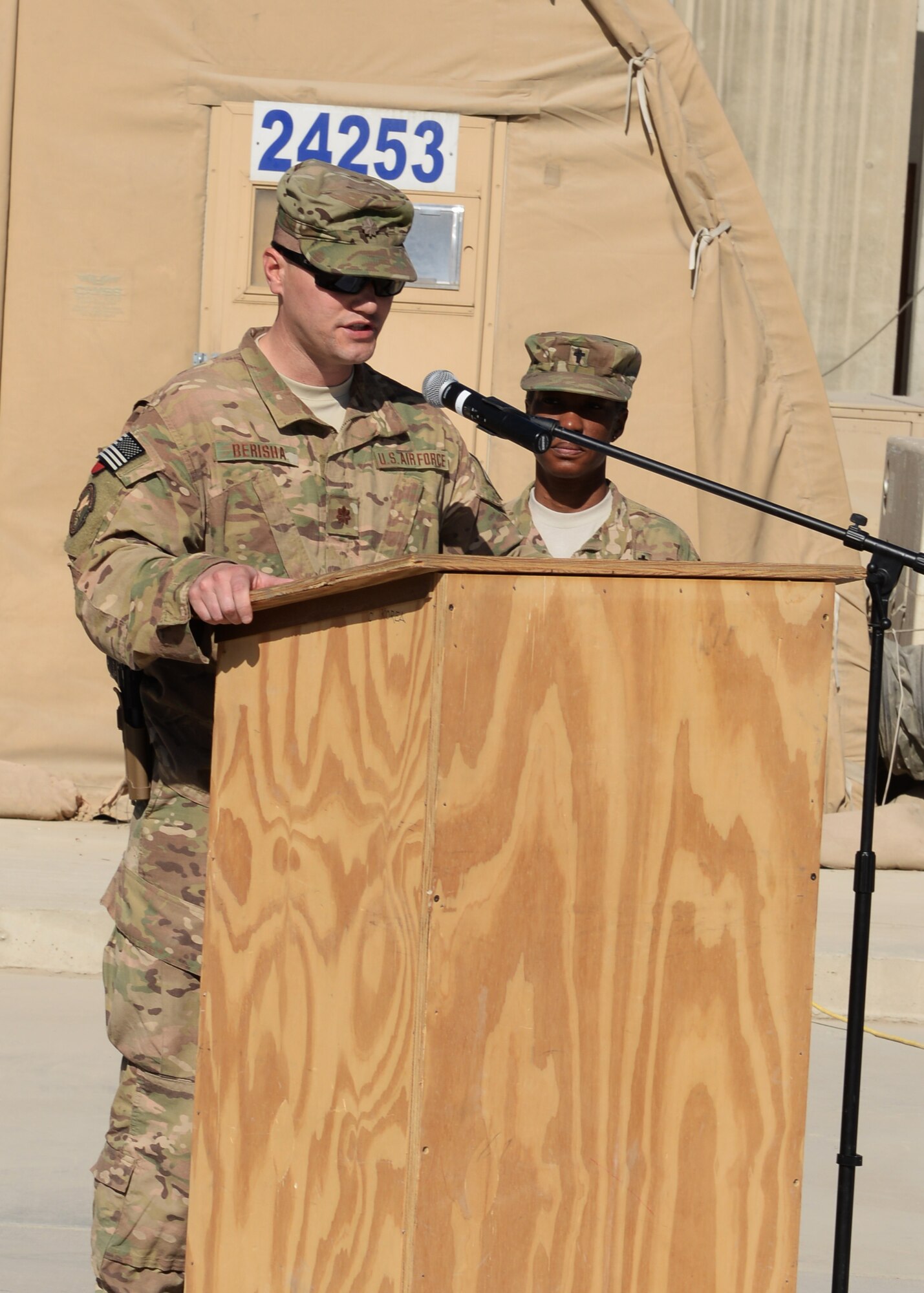 U.S Air Force Maj. Met Berisha, 455th Expeditionary Security Forces Squadron commander, shares his condolences for the six Airmen lost during a fallen comrade memorial ceremony Oct. 3, 2015, at Bagram Airfield, Afghanistan. The six Airmen, four who were pilots and crew members, Capts. Jordan Pierson and Jonathan Golden, Staff Sgt. Ryan Hammond and Senior Airman Quinn Johnson-Harris, and two who were security forces fly away security team members, Airman 1st Class Kcey Ruiz and Senior Airman Nathan Sartain, lost their lives when their C-130J crashed shortly after take-off from Jalalabad Airfield in Afghanistan, Oct. 2, 2015. (U.S. Air Force photo by Senior Airman Cierra Presentado/Released)
