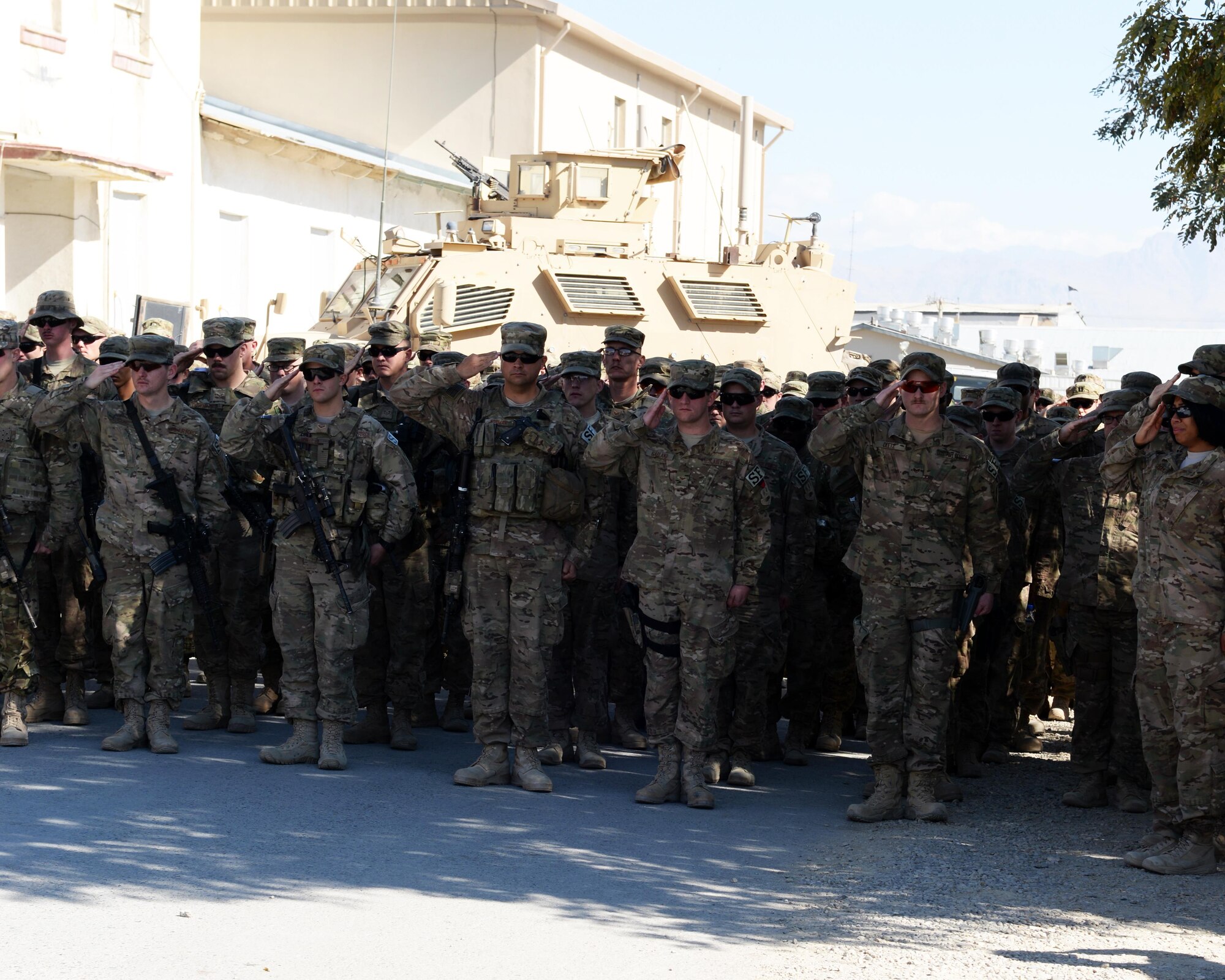 Airmen from the 455th Expeditionary Security Forces Squadron salute during a fallen comrade memorial ceremony for six Airmen, Oct. 3, 2015, at Bagram Airfield, Afghanistan. The six Airmen, four who were pilots and crew members, Capts. Jordan Pierson and Jonathan Golden, Staff Sgt. Ryan Hammond and Senior Airman Quinn Johnson-Harris, and two who were security forces fly away security team members, Airman 1st Class Kcey Ruiz and Senior Airman Nathan Sartain, lost their lives when their C-130J crashed shortly after take-off from Jalalabad Airfield in Afghanistan, Oct. 2, 2015. (U.S. Air Force photo by Senior Airman Cierra Presentado/Released)  