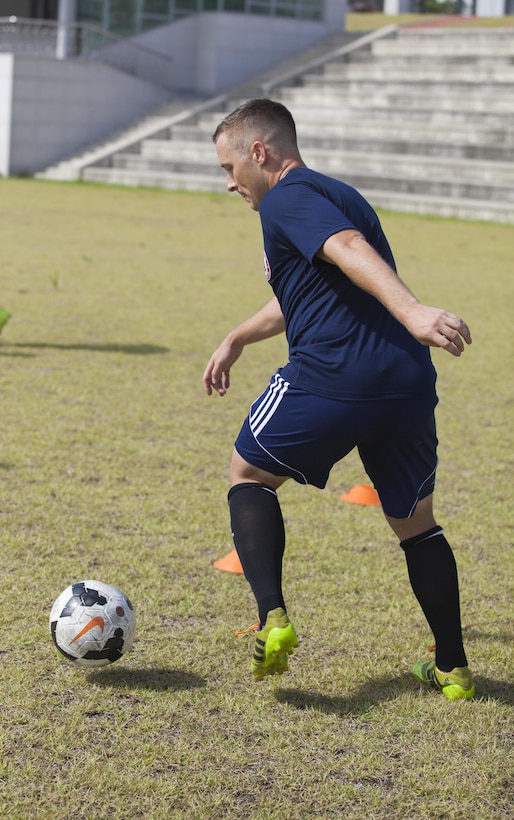 U.S. Air Force 2nd Lt. John Melcher traps the ball at a U.S. Mens Soccer Team practice at the 6th CISM World Games. The CISM World Games provides the opportunity for the athletes of over 100 different Nations to come together and enjoy friendship through sports. The sixth annual CISM World Games are being held aboard Mungyeong, South Korea, Sept. 30 - Oct. 11.