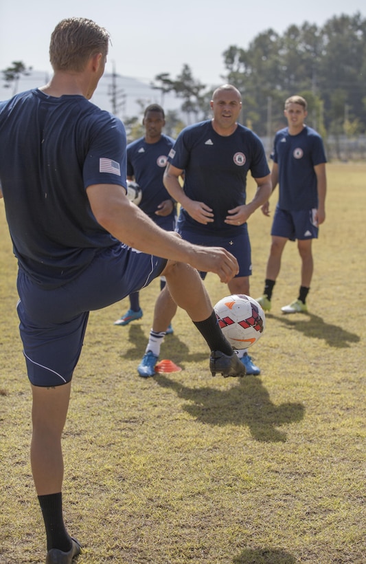 U.S. Military members of the U.S. Men's Soccer Team conduct drills during practice at the 6th CISM World Games. The CISM World Games provides the opportunity for the athletes of over 100 different Nations to come together and enjoy friendship through sports. The sixth annual CISM World Games are being held aboard Mungyeong, South Korea, Sept. 30 -Oct. 11.