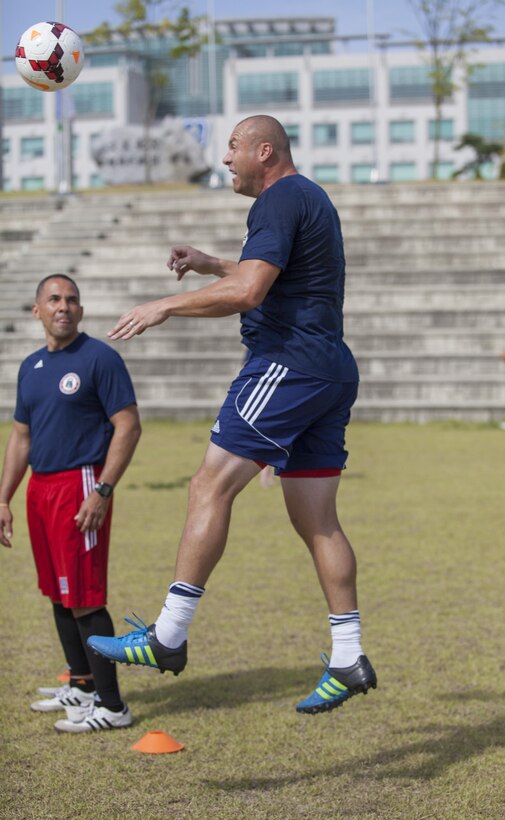 U.S. Army SSgt. Joshua Blodgett heads the ball during a U.S. Mens Soccer Team Practice at the 6th CISM World Games. The CISM World Games provides the opportunity for the athletes of over 100 different nations to come together and enjoy friendship through sports. The sixth annual CISM World Games are being held aboard Mungyeong, South Korea, Sept. 30 - Oct. 11.