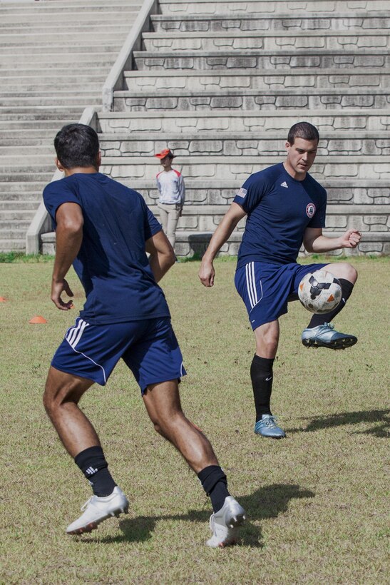 United States Men’s Soccer Team players SN Craig Smith and 2nd Lt. Aaron Zendejas practices for the 2015 6th CISM World Games. The CISM World Games provides the opportunity for the athletes of over 100 different Nations to come together and enjoy friendship through sport. The sixth annual CISM World Games are being held aboard Mungyeong, South Korea, Sept. 30 -Oct.11.  (Photo by Sgt. Ashley N. Cano)