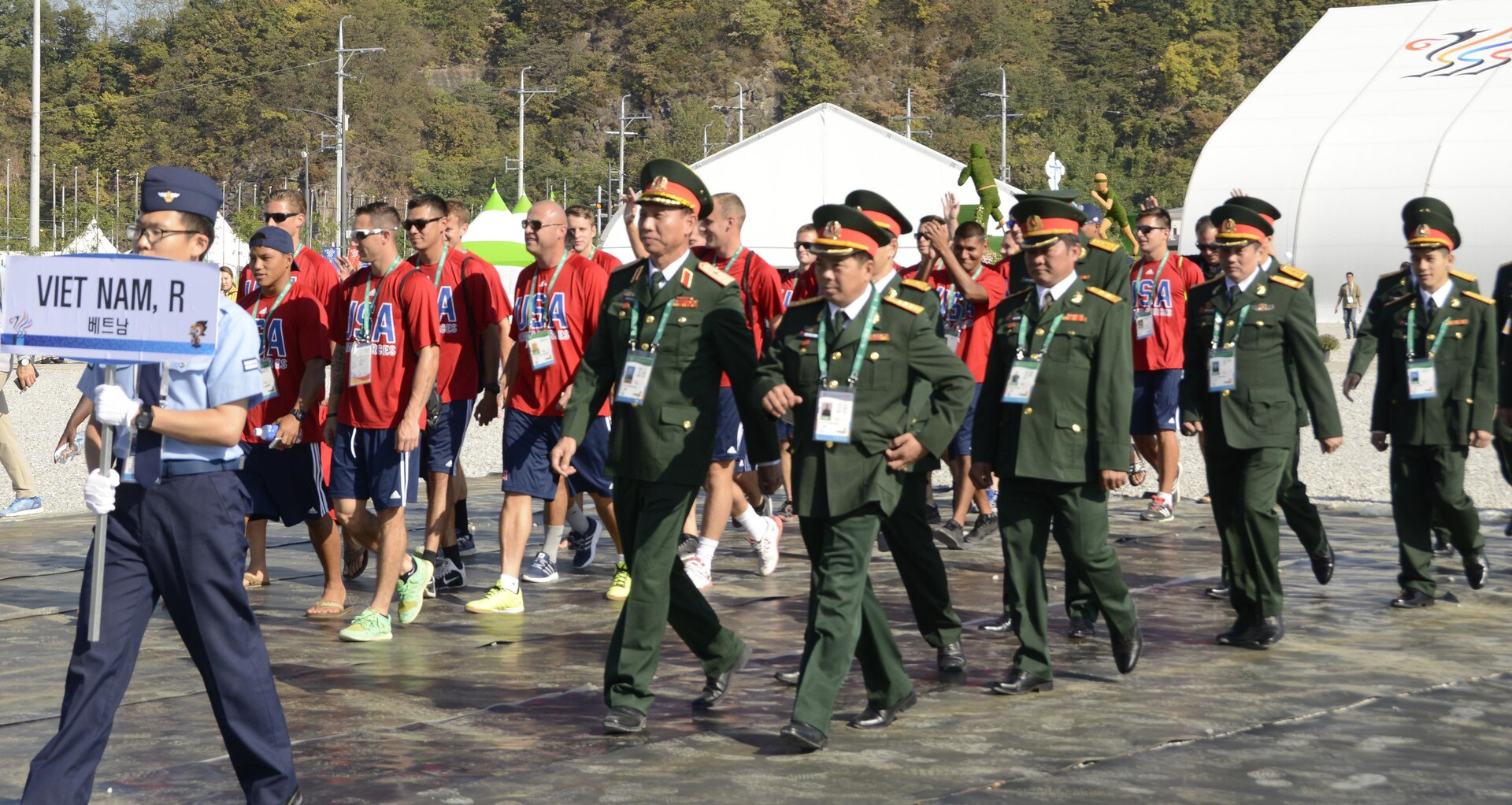 The U.S. Armed Forces Men's Soccer Team and Soldiers from the Republic of Vietnam march together into the opening ceremony of Mungyeong Athlete's Village, Sept. 29, 2015, for the CISM World Games in South Korea.