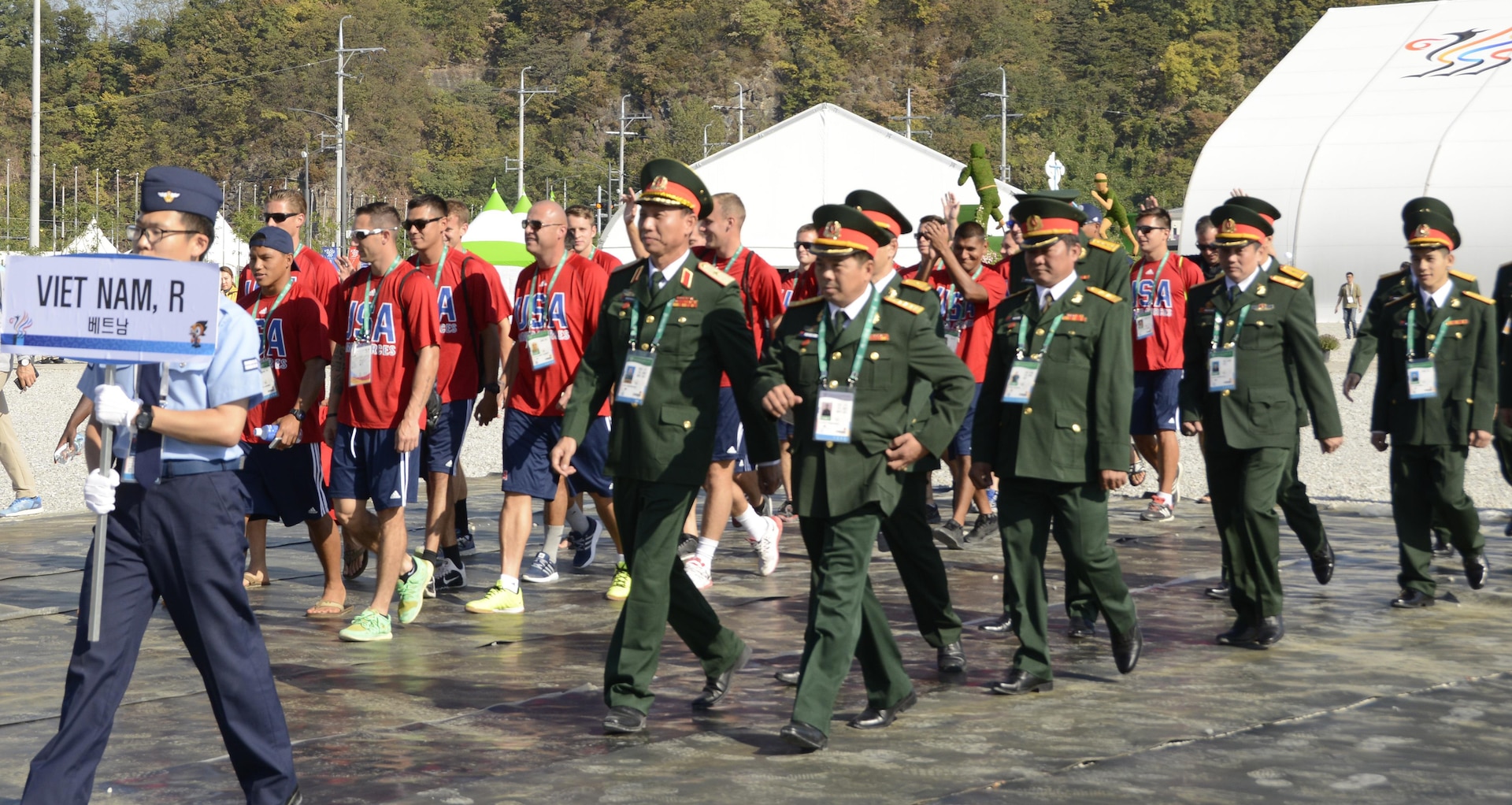 The U.S. Armed Forces Men's Soccer Team and Soldiers from the Republic of Vietnam march together into the opening ceremony of Mungyeong Athlete's Village, Sept. 29, 2015, for the CISM World Games in South Korea.