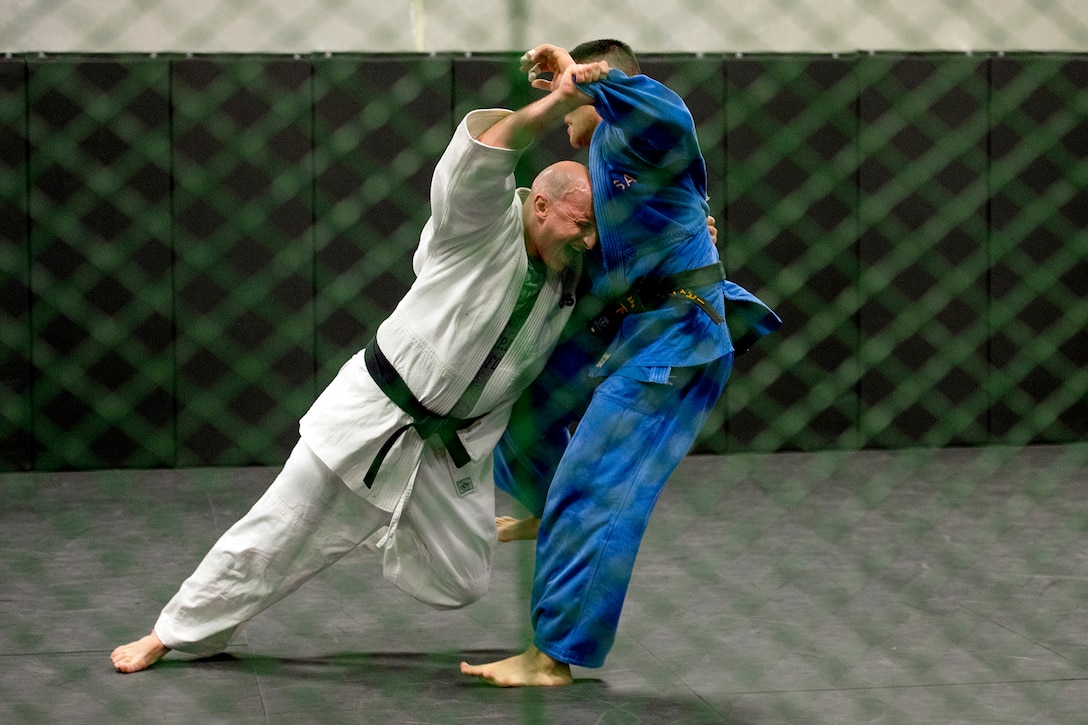 Army Lt. Col. Ben Ring, left and Navy Petty Officer 2nd Class Bobby Yamashita spar during U.S. Armed Forces Judo Team practice at Fort Indiantown Gap, Pa., Sept. 21, 2015. The team is training for the 2015 Military World Games in Mungyeong, South Korea, scheduled for Oct. 2 through Oct. 11. (DoD News photo by EJ Hersom)