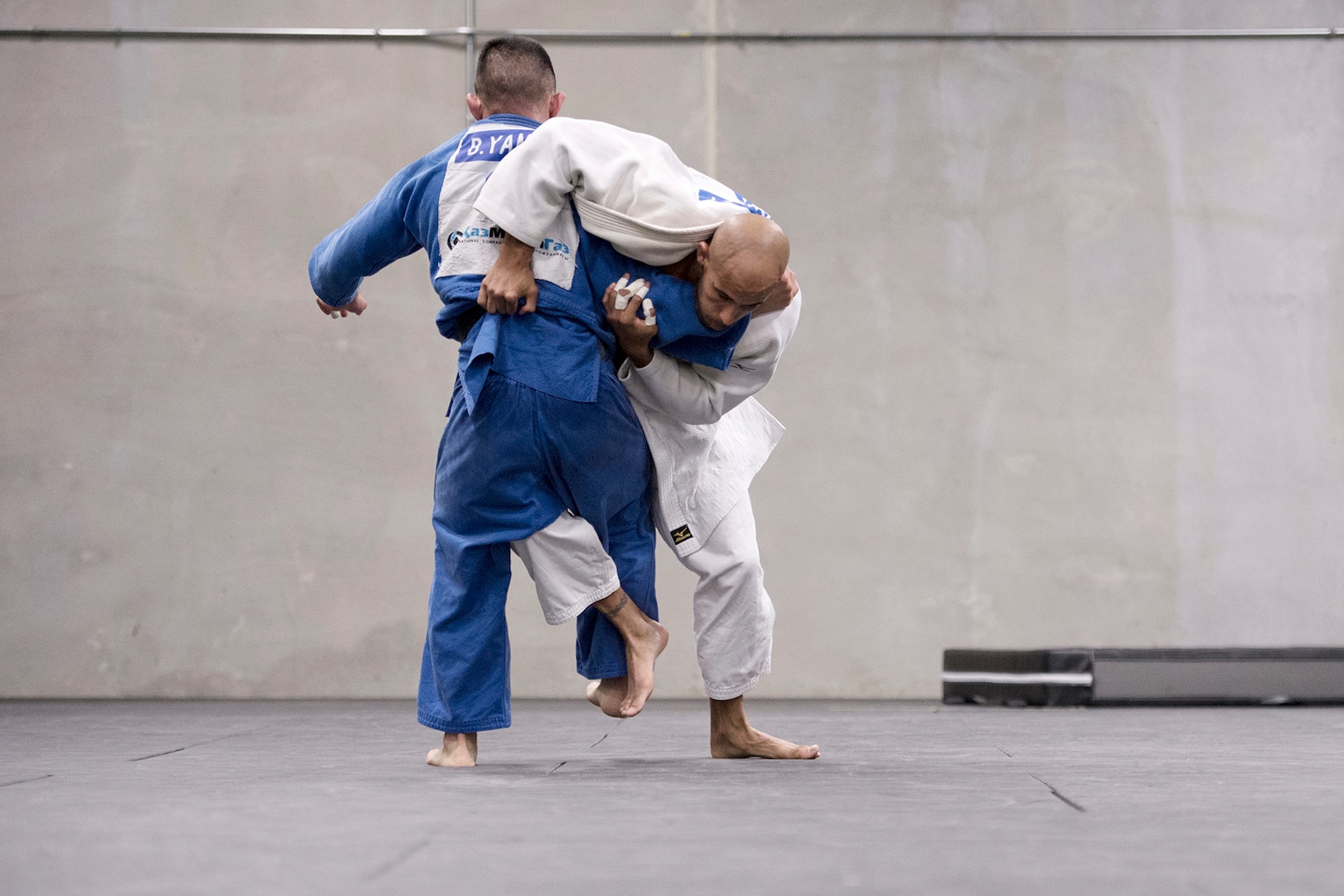 Navy Petty Officer 2nd Class Bobby Yamashita, left and Navy Petty Officer 1st Class Robert Turquest spar during U.S. Armed Forces Judo Team practice at Fort Indiantown Gap, Pa., Sept. 21, 2015. The team is training for the 2015 Military World Games in Mungyeong, South Korea, scheduled for Oct. 2 through Oct. 11. (DoD News photo by EJ Hersom)