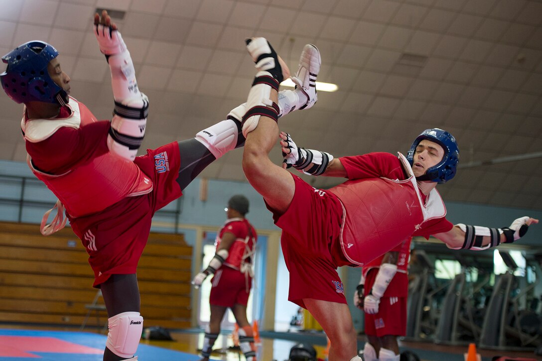 Army 1st Lt. Joshua Fletcher, right, and Air Force Tech Sgt. Quinton Beach exchange kicks during U.S. Armed Forces Tae Kwon Do Team practice at Fort Indiantown Gap, Pa., Sept. 21, 2015. The team is training for the 2015 Military World Games in Mungyeong, South Korea, scheduled for Oct. 2 through Oct. 11. (DoD News photo by EJ Hersom)