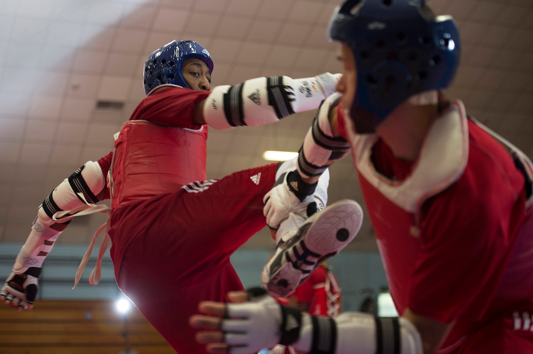 Army 1st Lt. Joshua Fletcher, right, and Air Force Tech Sgt. Quinton Beach spar during U.S. Armed Forces Tae Kwon Do Team practice at Fort Indiantown Gap, Pa., Sept. 21, 2015. The team is training for the 2015 Military World Games in Mungyeong, South Korea, scheduled for Oct. 2 through Oct. 11. (DoD News photo by EJ Hersom)