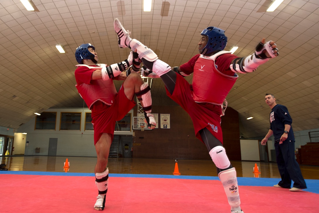 Army 1st Lt. Joshua Fletcher, left, and Air Force Tech Sgt. Quinton Beach spar during U.S. Armed Forces Tae Kwon Do Team practice at Fort Indiantown Gap, Pa., Sept. 21, 2015. The team is training for the 2015 Military World Games in Mungyeong, South Korea, scheduled for Oct. 2 through Oct. 11. (DoD News photo by EJ Hersom)