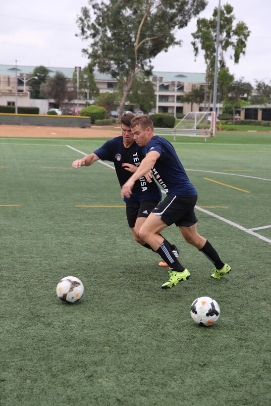 Service members with the U.S. Men’s Armed Forces Soccer Team go head to head during a practice session aboard Marine Corps Air Station Miramar, Calif., Sept. 22. The team is scheduled to play in the upcoming World Military Games in South Korea. (U.S. Marine photo by Lance Cpl. Kimberlyn Adams/Released)