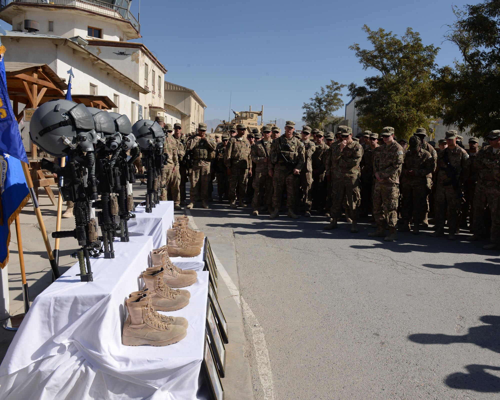 Airmen of the 455th Air Expeditionary Wing pay their respect and mourn the loss of six Airmen during a fallen comrade memorial ceremony Oct. 3, 2015, at Bagram Airfield, Afghanistan. The six Airmen, four who were pilots and crew members, Capts. Jordan Pierson and Jonathan Golden, Staff Sgt. Ryan Hammond and Senior Airman Quinn Johnson-Harris, and two who were security forces fly away security team members, Airman 1st Class Kcey Ruiz and Senior Airman Nathan Sartain, lost their lives when their C-130J crashed shortly after take-off from Jalalabad Airfield in Afghanistan, Oct. 2, 2015. (U.S. Air Force photo by Senior Airman Cierra Presentado/Released)