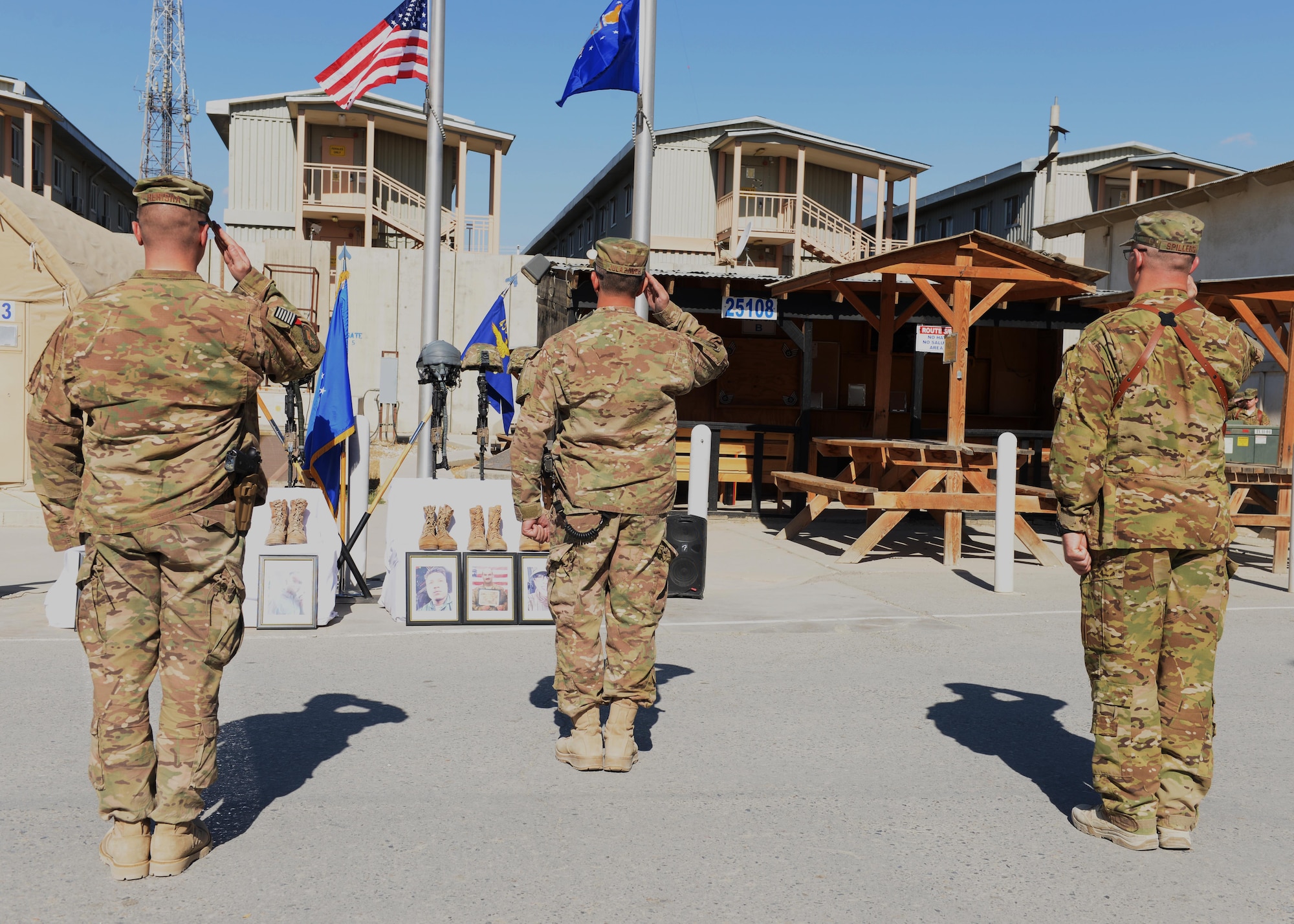 Maj. Met Berisha (left), the 455th Expeditionary Security Forces Squadron commander; Brig. Gen. David Julazadeh (center), the 455th Air Expeditionary Wing commander; and Lt. Col. Mitchell Spillers, the 774th Expeditionary Airlift Squadron commander, salute the memorial of six fallen Airmen during a fallen comrade ceremony Oct. 3, 2015, at Bagram Airfield, Afghanistan. Six Airmen lost their lives when their C-130J Super Hercules crashed shortly after takeoff from Jalalabad Airfield in Afghanistan, Oct. 2, 2015. Capts. Jordan Pierson and Jonathan Golden, Staff Sgt. Ryan Hammond and Senior Airman Quinn Johnson-Harris were pilots and crew members. Airman 1st Class Kcey Ruiz and Senior Airman Nathan Sartain were security forces fly away security team members. (U.S. Air Force photo/Senior Airman Cierra Presentado)