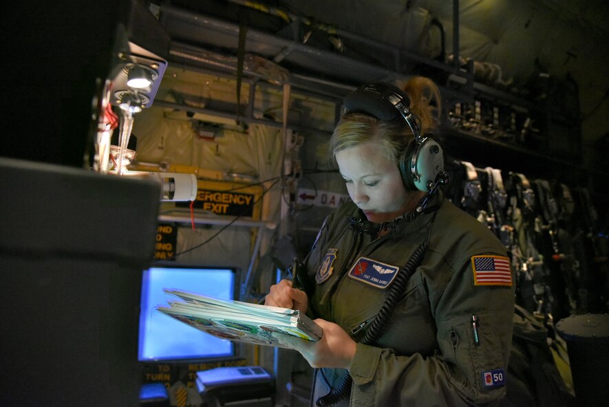 Tech. Sgt. Jenna Daniel, a 53rd Weather Reconnaissance Squadron loadmaster, logs information on a dropsonde to be dropped in the eye wall of Hurricane Joaquin during a mission into the storm Oct. 2, 2015. Hurricane Joaquin was downgraded to a Catergory 3 storm. (U.S. Air Force photo/Staff Sgt. Staff Sgt. Nicholas Monteleone)