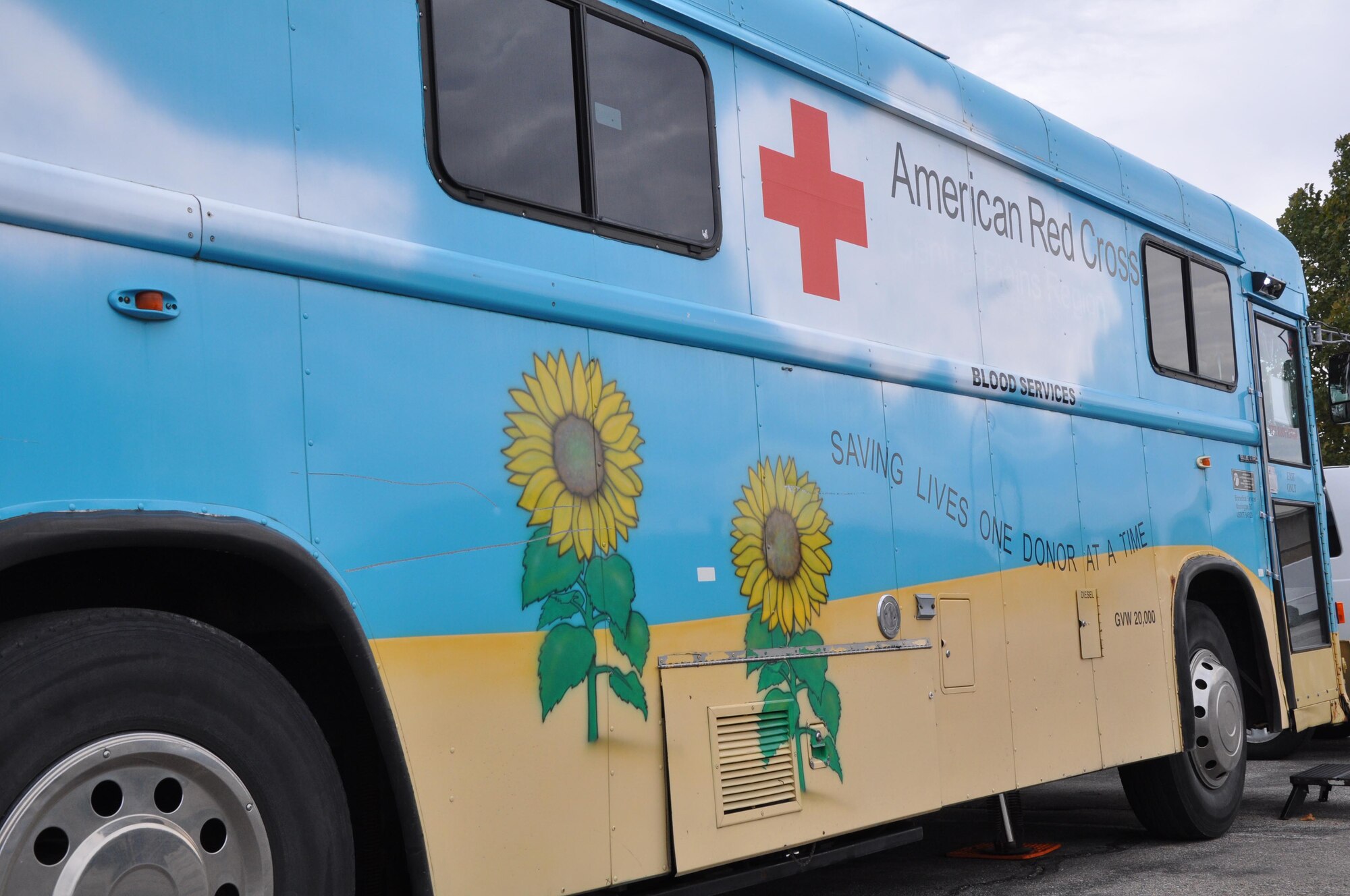 A bloodmobile provided by the American Red Cross is parked near Building 850, Oct. 3, 2015, at McConnell Air Force Base, Kan. Twenty-three McConnell Reservists lined up to donate blood to aid the niece of Tech. Sgt. Stacey Spain, 931st Air Refueling Group Emergency Management NCOIC. (U.S. Air Force photo by Tech. Sgt. Abigail Klein)

