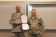 Maintenance group commander Col. Scott Plambeck presents Moville native Tom Conolly a promotion order, promoting him to the rank of Chief Master Sergeant in the Iowa Air National Guard during a ceremony at the 185th Air Refueling Wing (ARW), in Sioux City, Iowa, on October 3, 2015. Conolly has been serving in the military for over thirty-five years and is the new, 185th ARW maintenance operations flight superintendent.
U.S. Air National Guard Photo by: TSgt Oscar Sanchez 185th ARW Wing Public Affairs/Released
