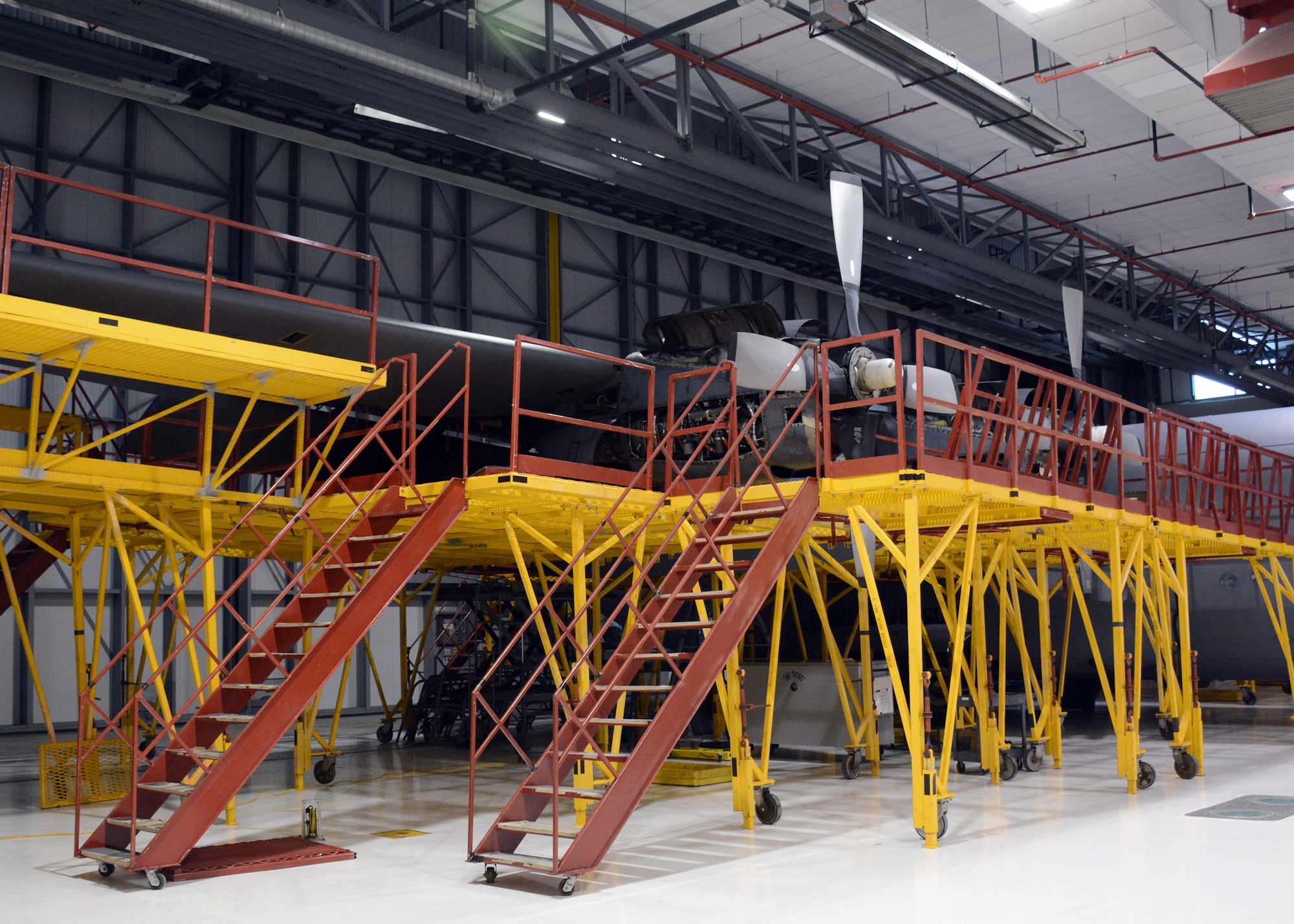A portion of 12-pieces of C-130 Hercules exterior access maintenance stands provided by Dyess Air Force Base, Texas, are assembled in the 120th Airlift Wing’s main hangar in Great Falls, Mont., on Jan. 30, 2015. (U.S. Air National Guard photo/Senior Master Sgt. Eric Peterson)  